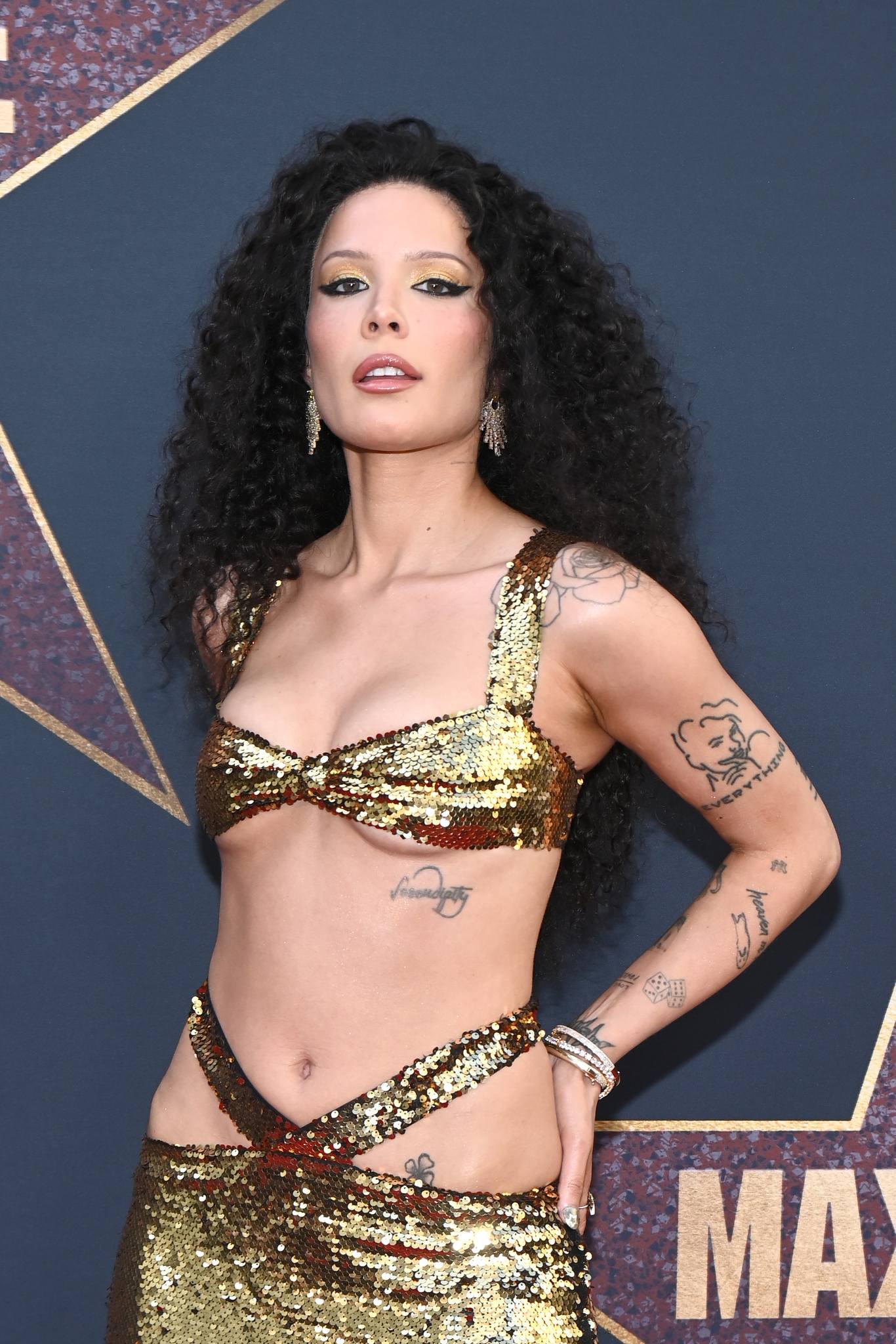 Halsey wore a glittering gold gown to the premiere of A24's 