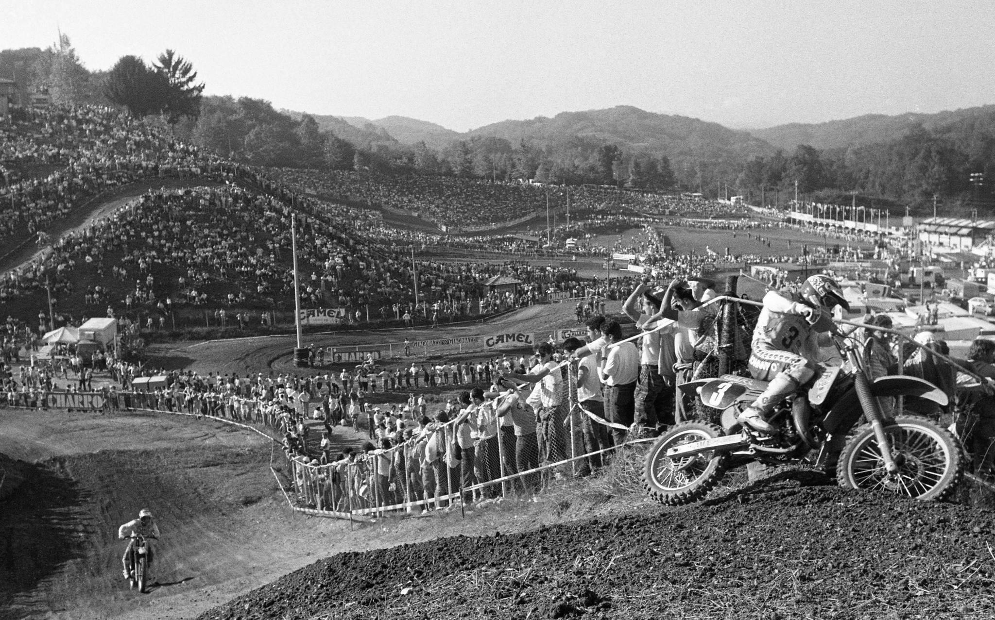 Rider - Fans are jammed packed around the track at the 1986 Motocross ...