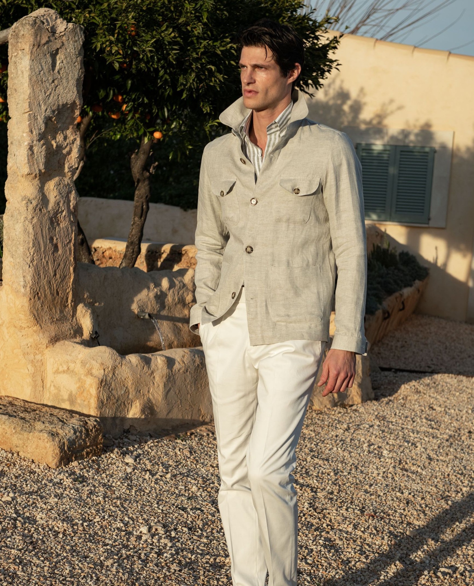 Our Stone Herringbone Linen Safari Jacket pays homage to the 