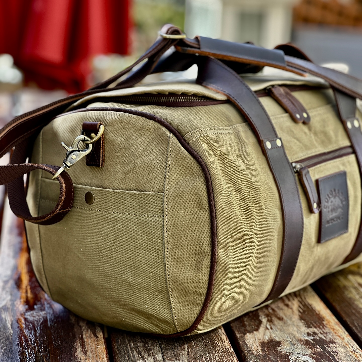 Durable canvas and leather duffel bag in forest green from Gander