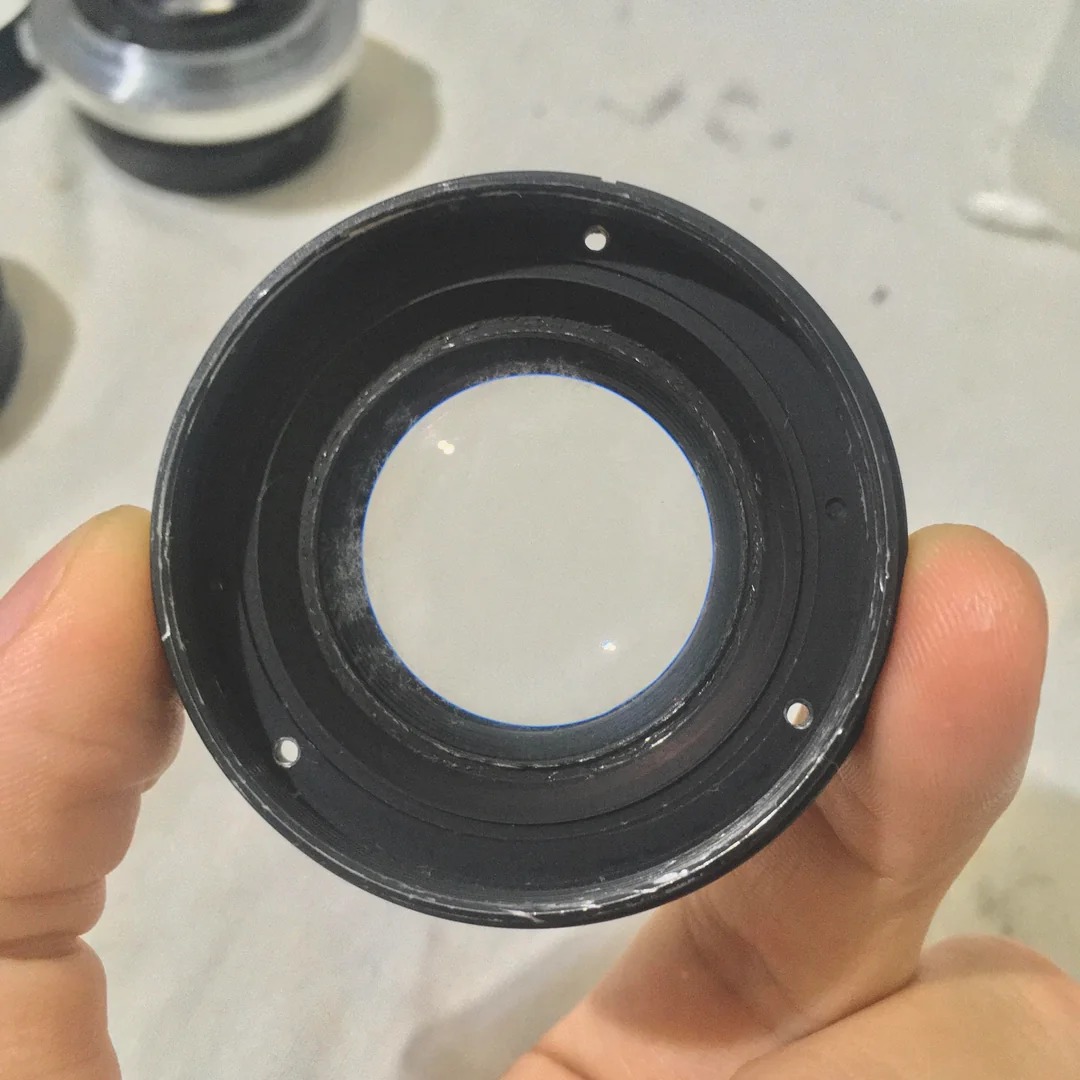How to disassemble Olympus OM-System 50mm lens to clean fungus?