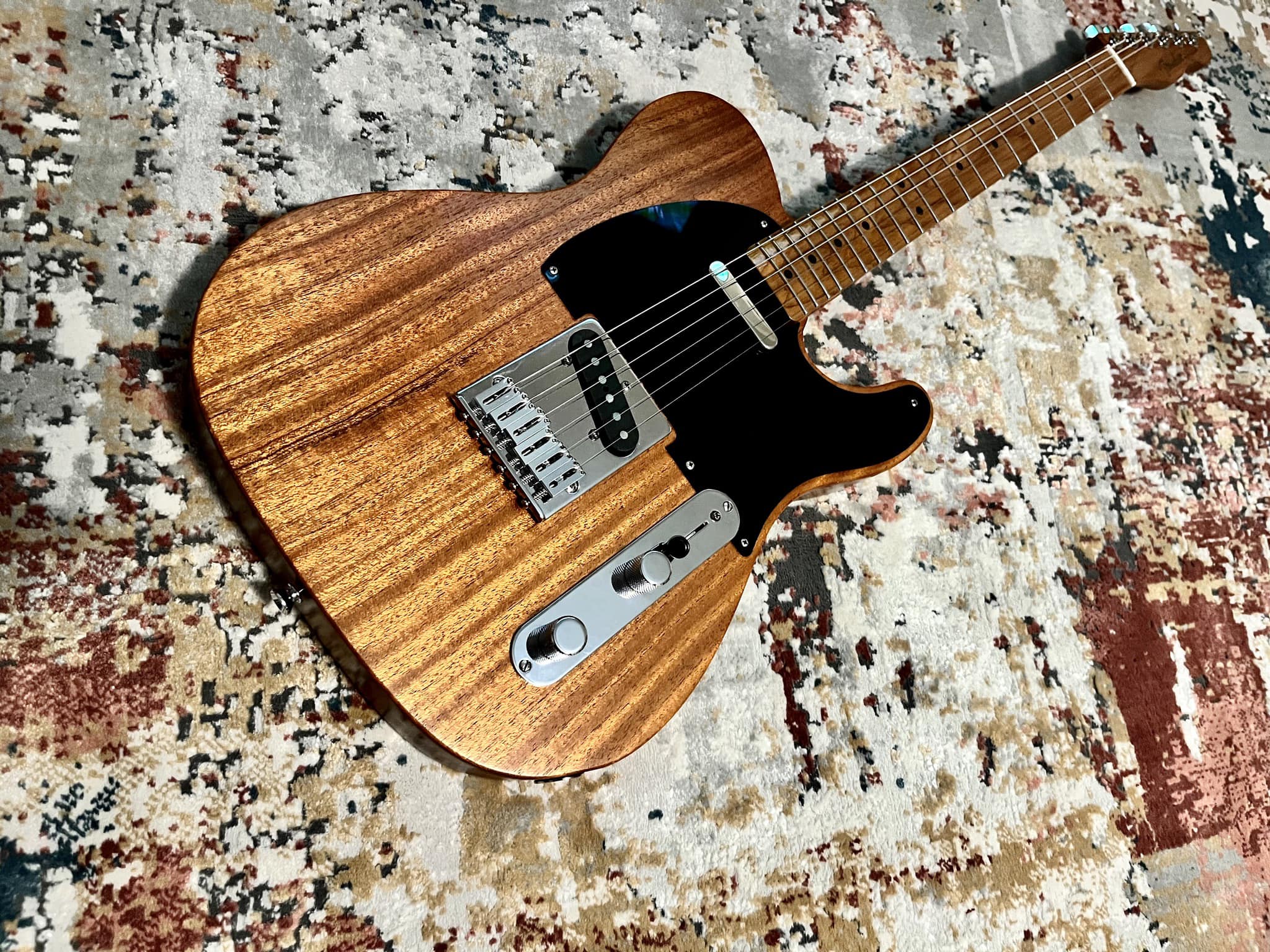 Telecaster guitar body with orange dye and Tru Oil finish