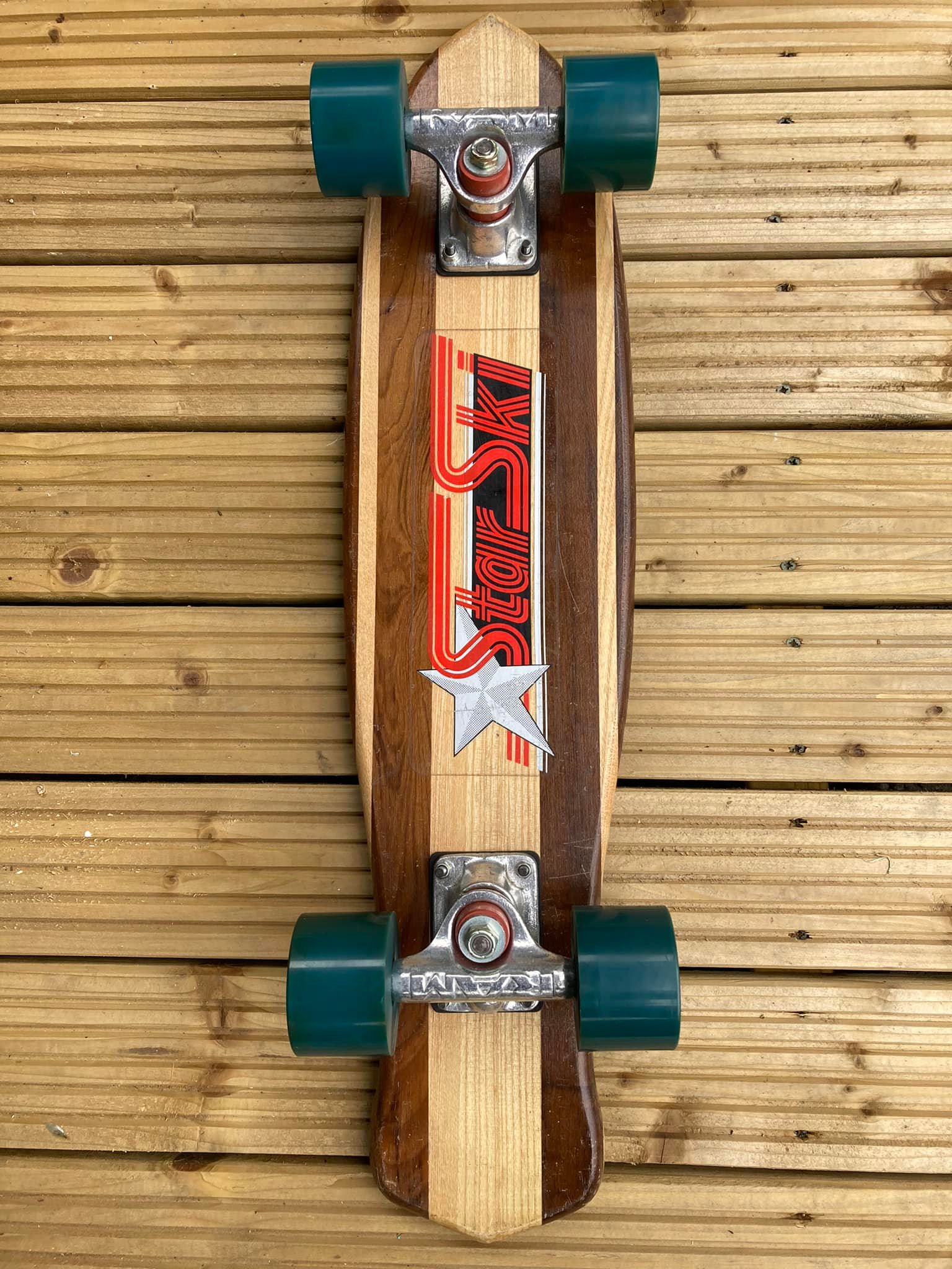 1970's Sims skateboard with tracker trucks on display