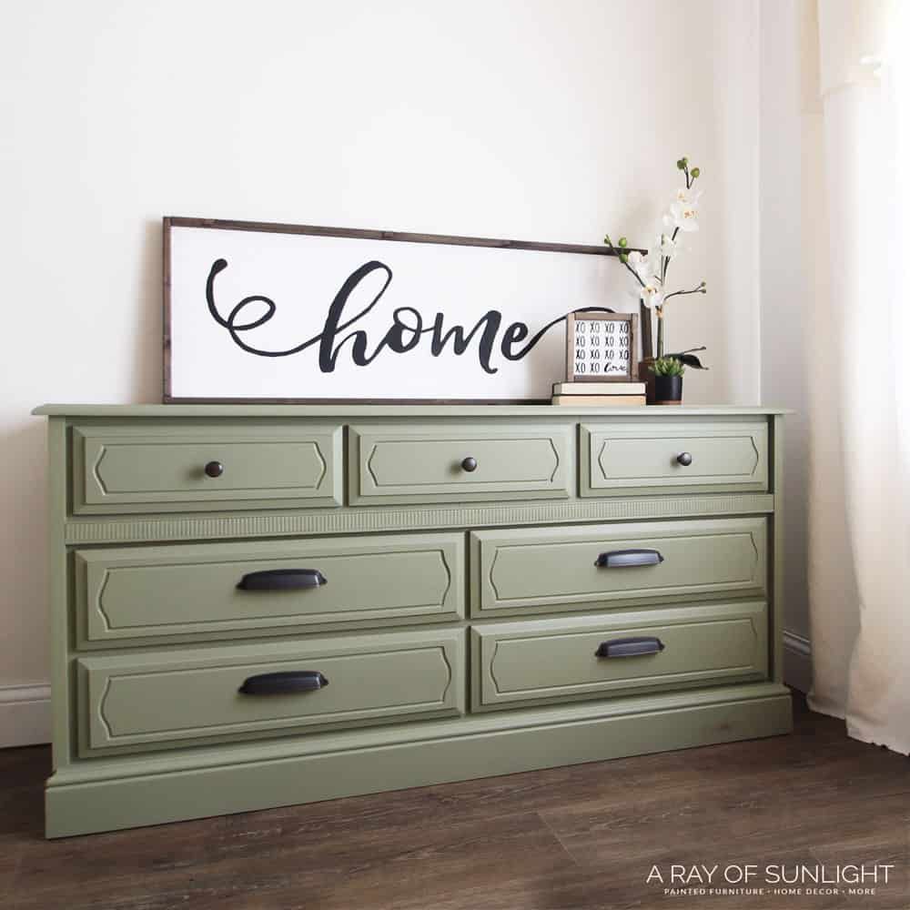 olive green painted dresser Like the choice of and the addition of new drawer pulls on this laminated dresser? Get the details here: ➡ https://arayofsunlight.com/paint -laminate-furniture-olive-green rose_gold_belt