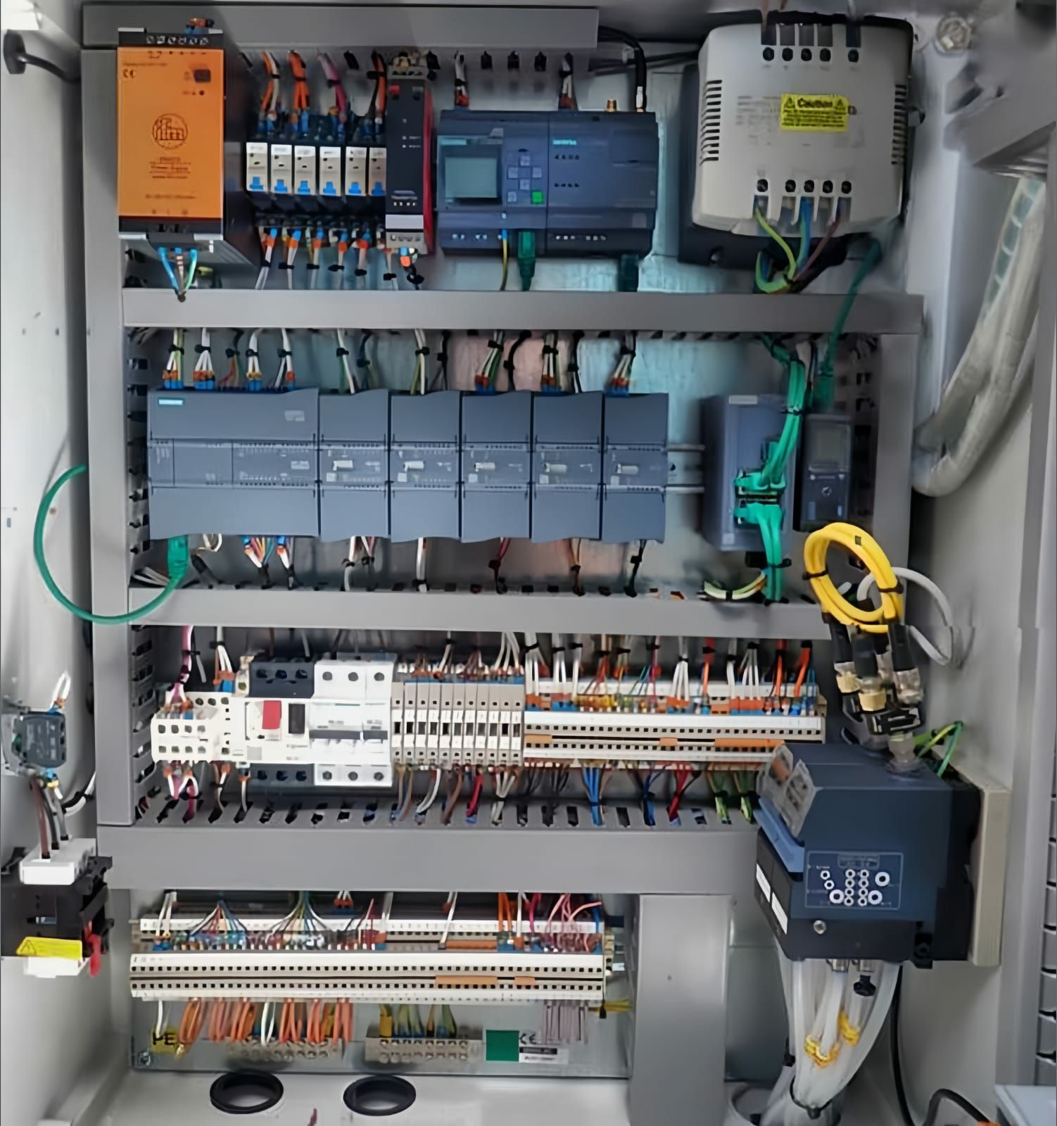 PLC PROGRAMMING | An industrial automation control panel featuring a ...