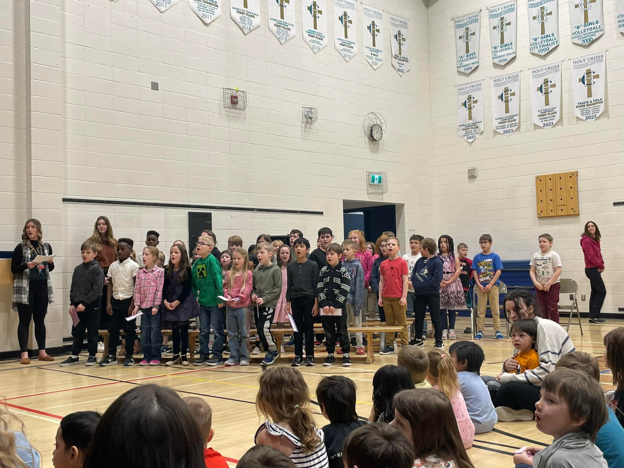 Grade 2A and Grade 4A led a... - Holy Cross Catholic School