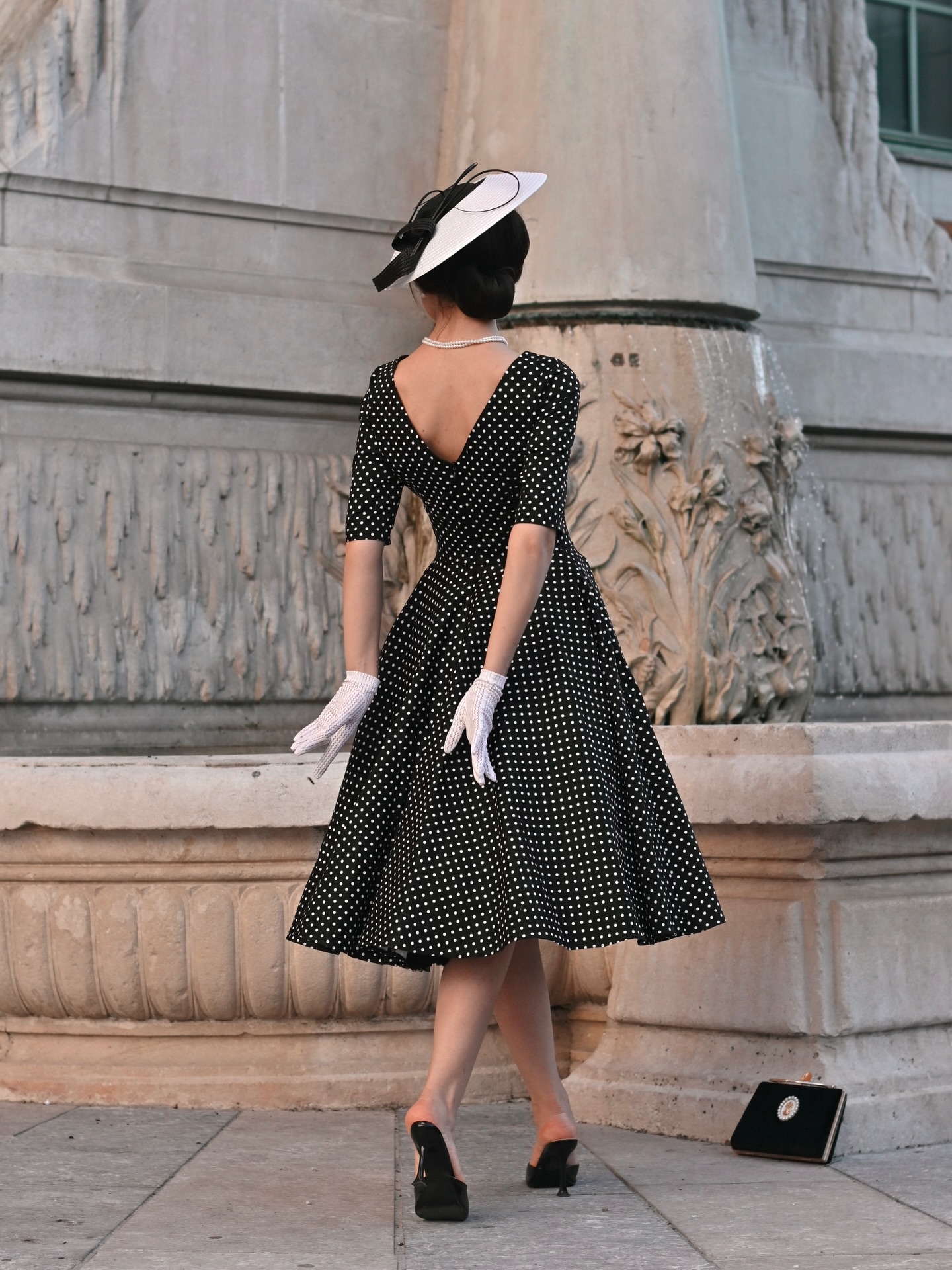Timeless 1950s-inspired polka dot dress with v-back detail