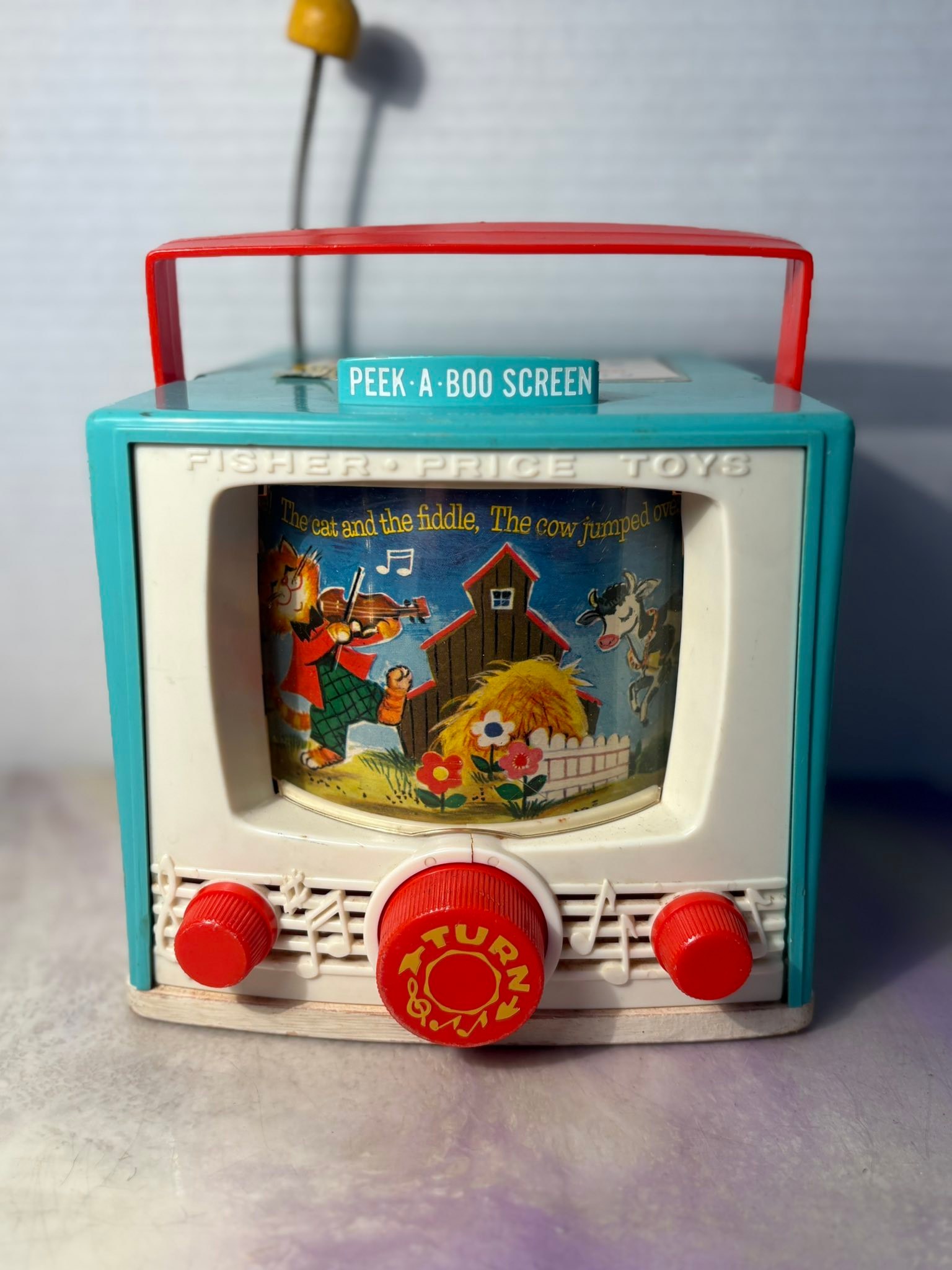 Fisher Price music box TV from the 60s. Complete wth Peek-a-boo screen