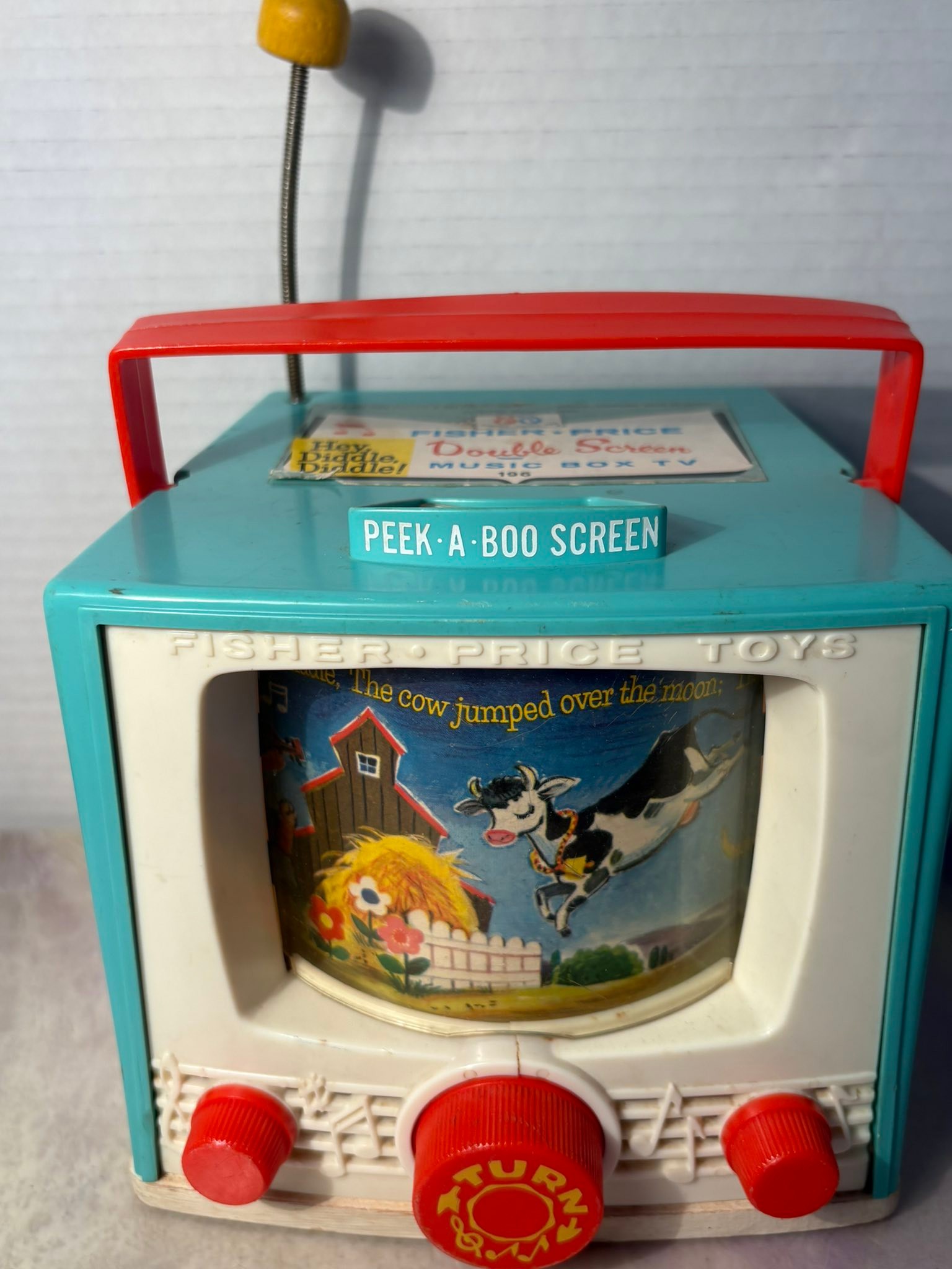 Fisher Price music box TV from the 60s. Complete wth Peek-a-boo screen