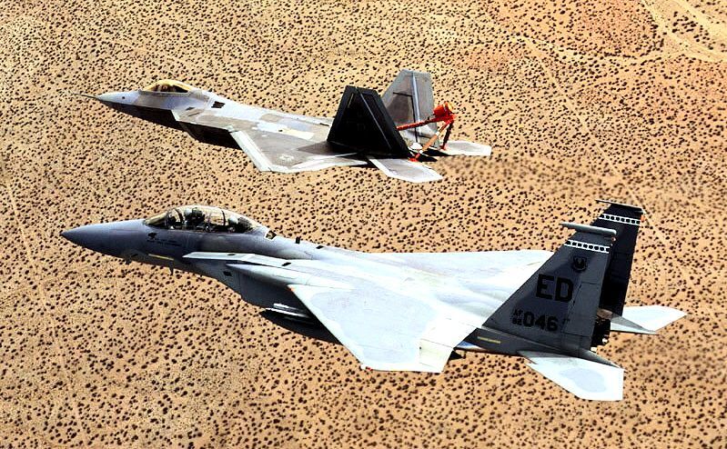 PlaneHistoria - An F-22 Raptor is shadowed by an F-15 Eagle chase plane ...