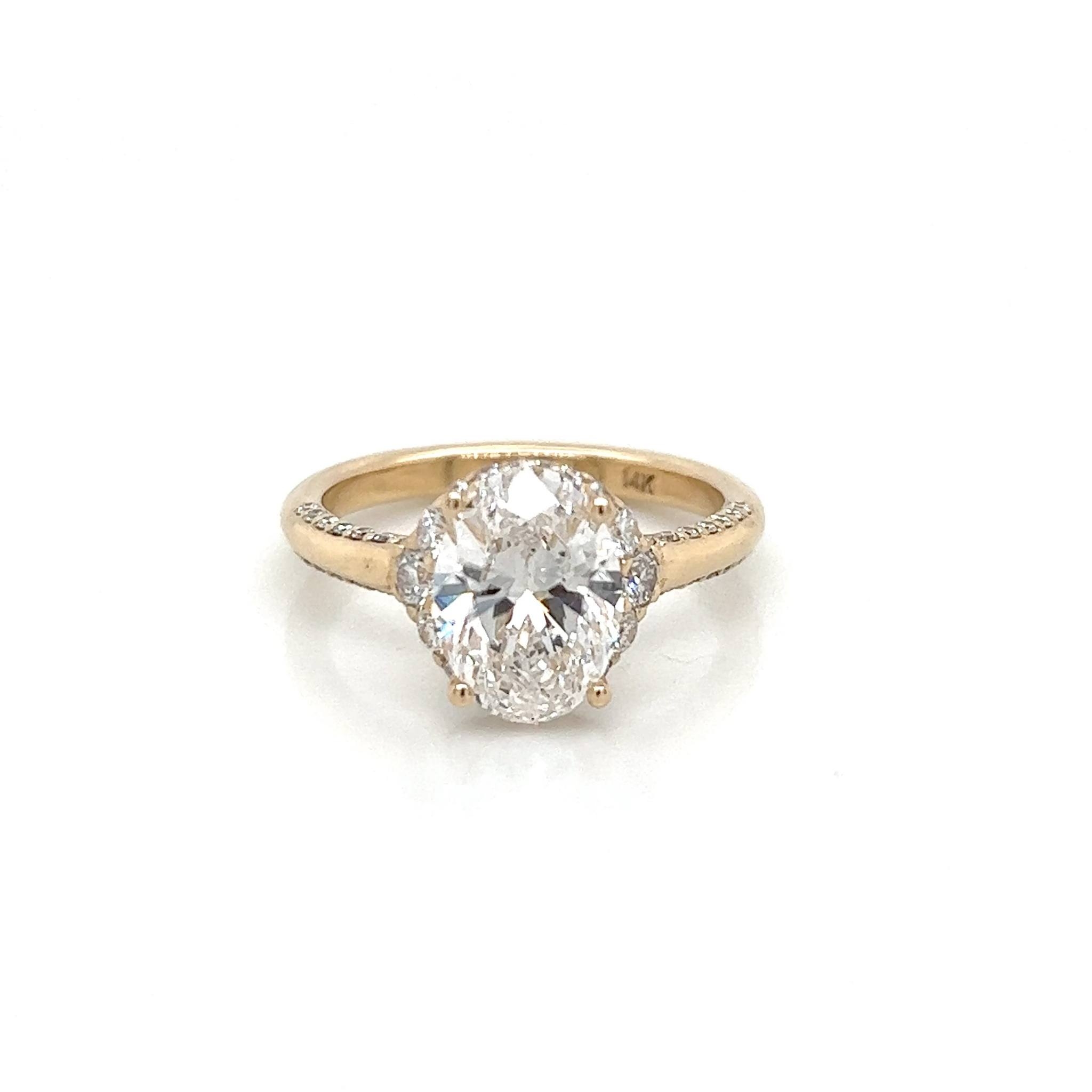 4 1/2 carat oval emerald with trillion cut diamond accents. I remade ...