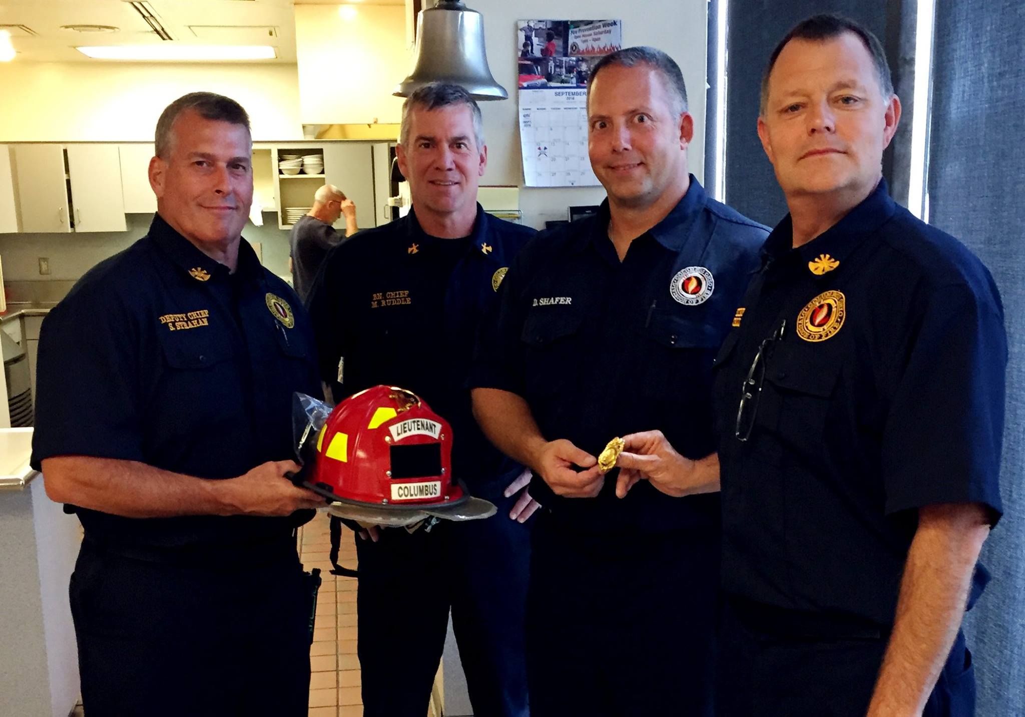 Columbus - Newly promoted firefighter Lt. Dan Shafer receives his new ...