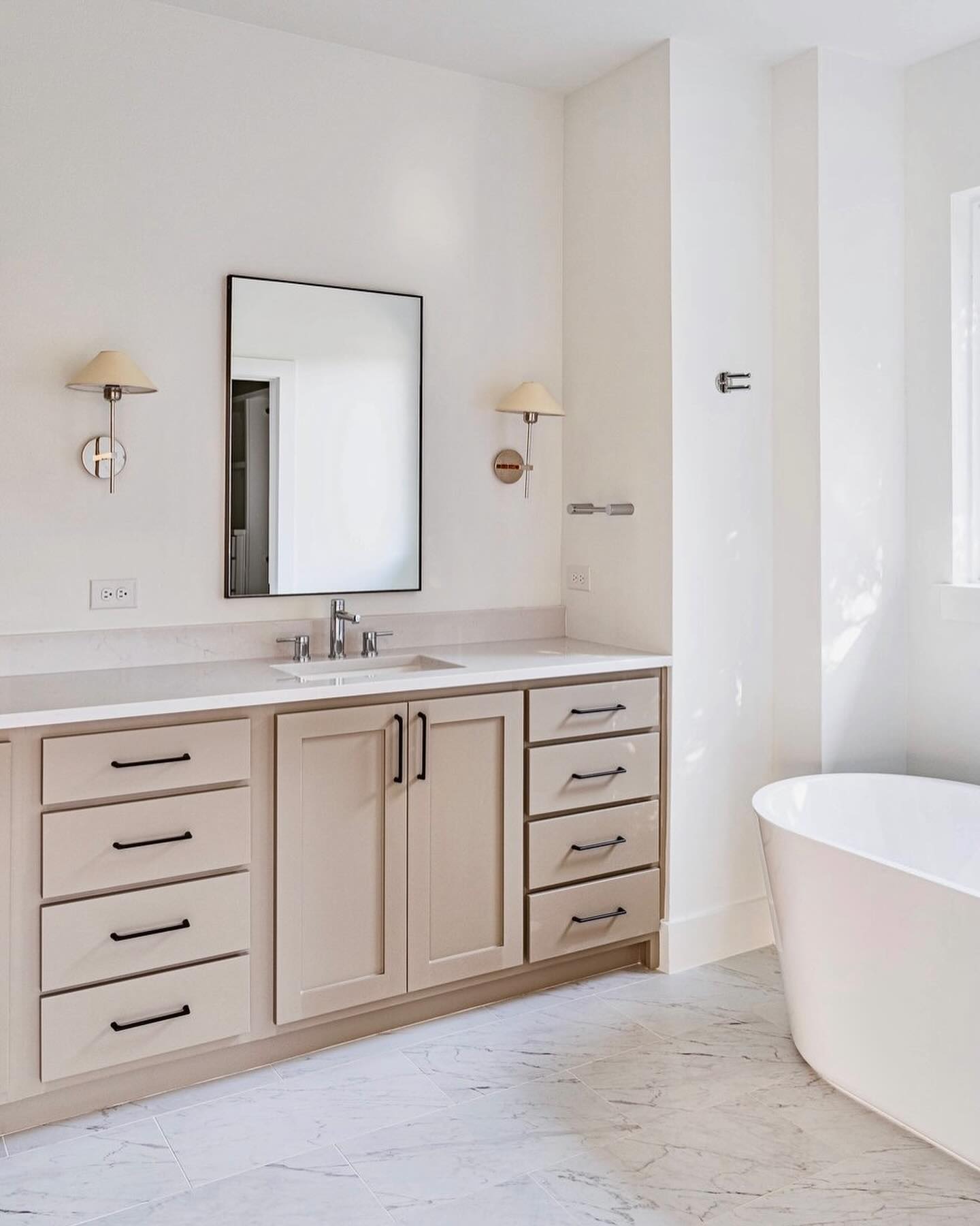 Richland Builds - A crisp and clean primary bathroom with...