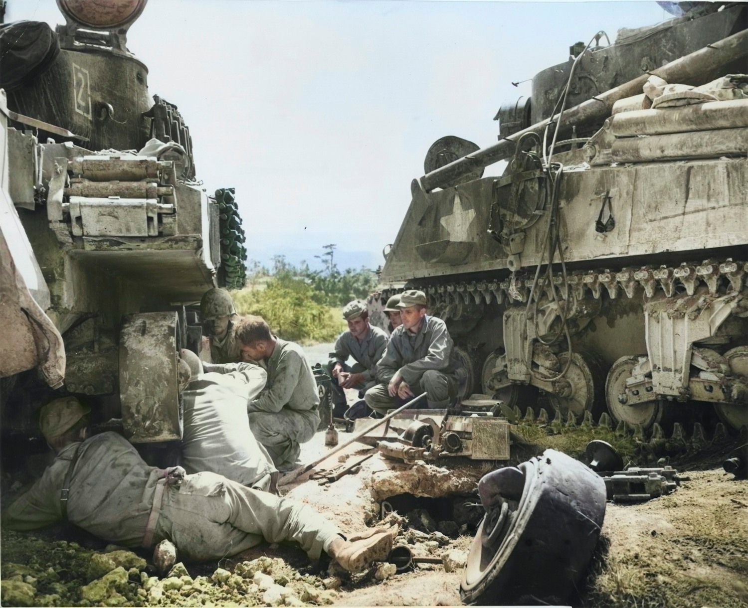 The crew of M32 tank recovery vehicle and US Marines repairing a