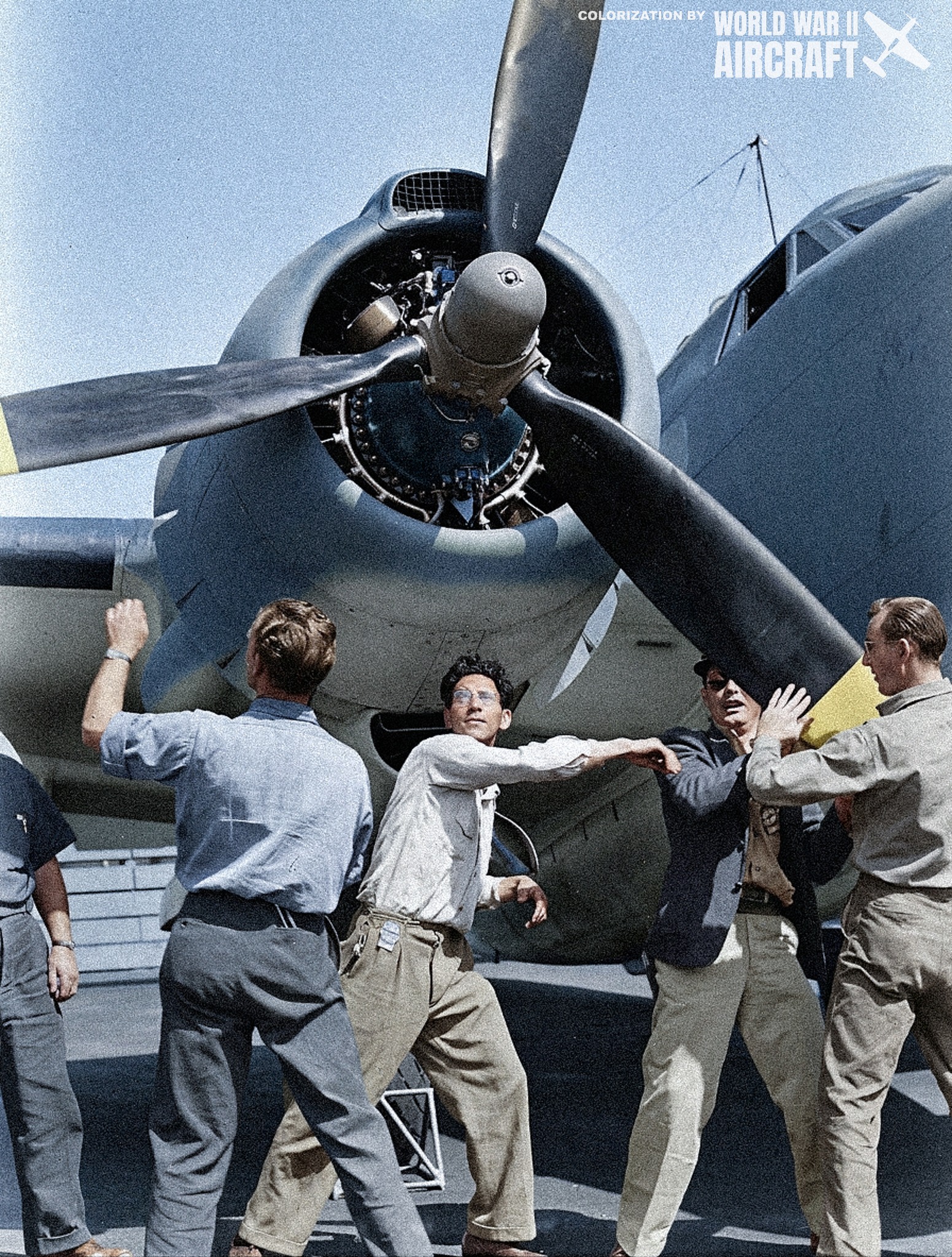 Workers rotate the propeller of a newly built Lockheed PV-1