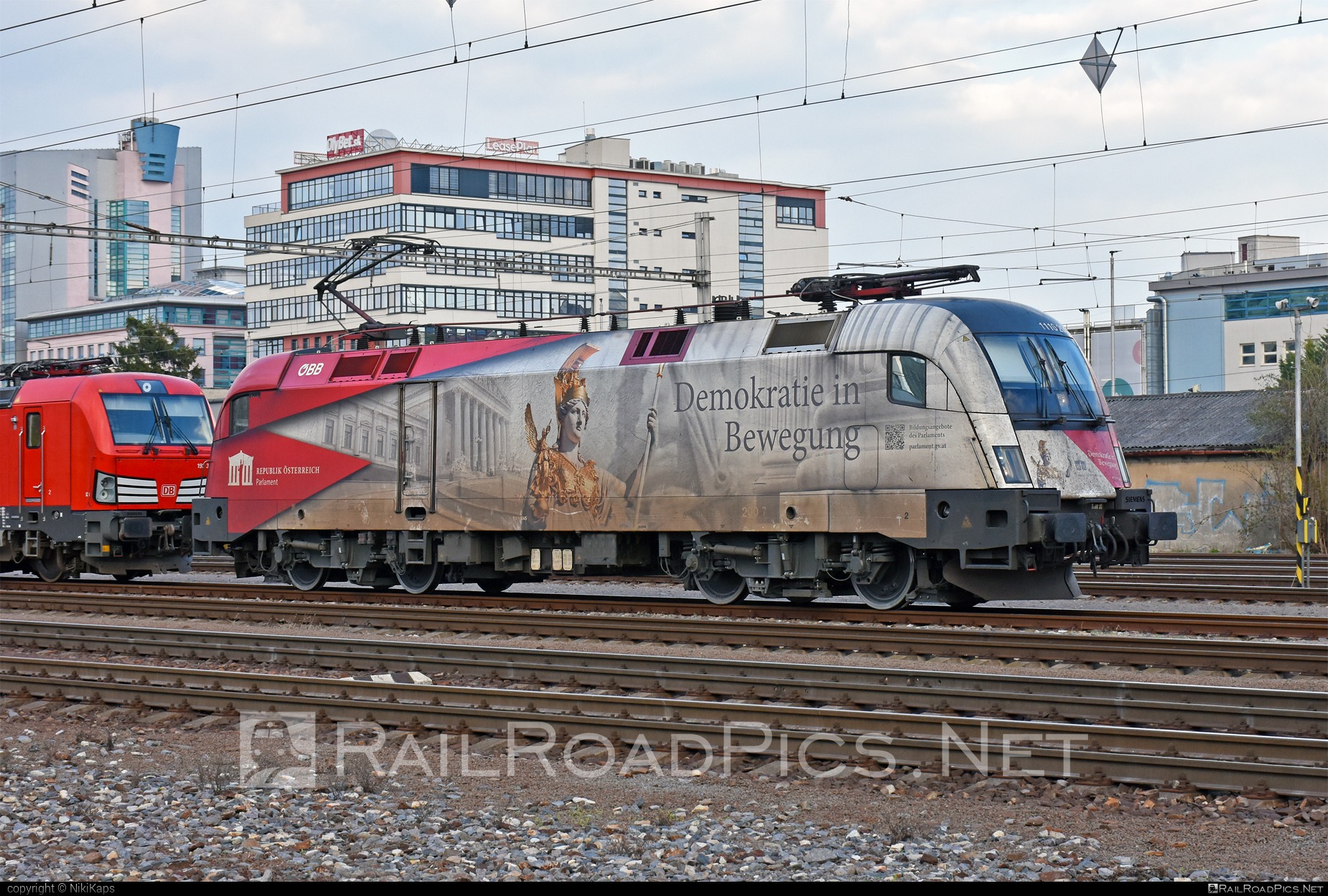 Taurus 1116 locomotive with Demokria in Bewegung sticker