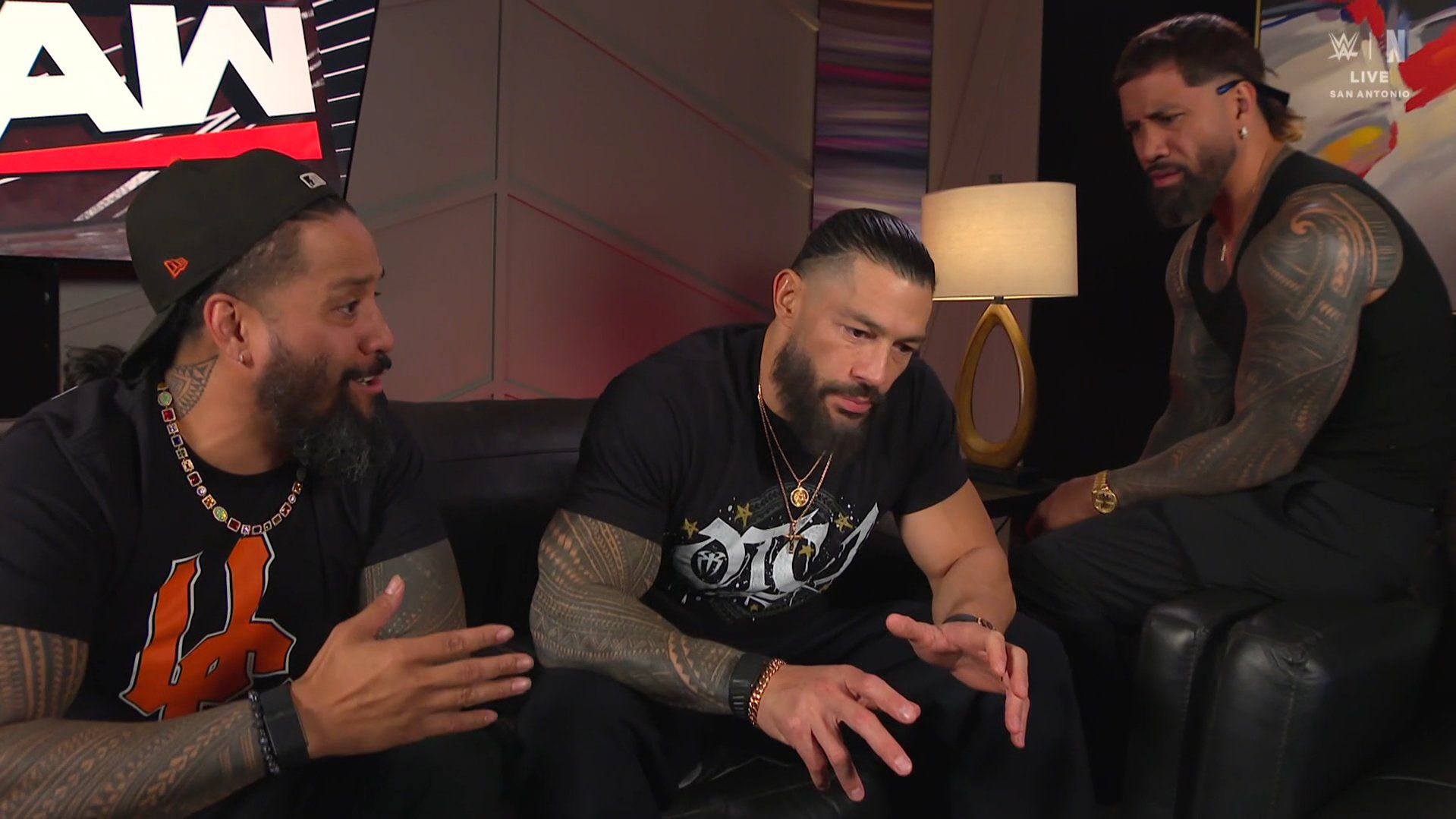 The Usos talks with Roman Reigns backstage. The Usos says they're