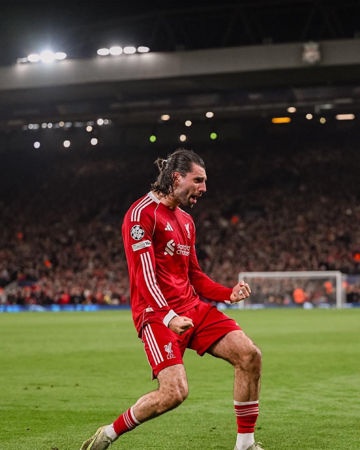 Dominik Szoboszlai #8 with long hair, in red adidas kit.