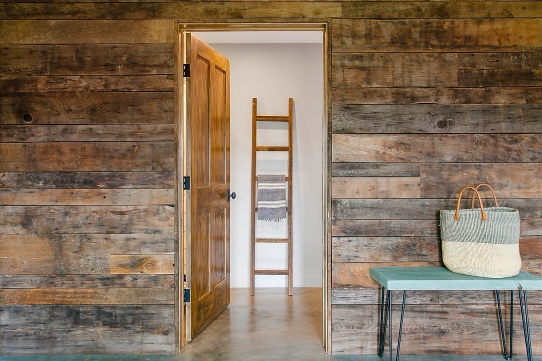 MB - The utilization of reclaimed barnwood wall paneling results in a ...