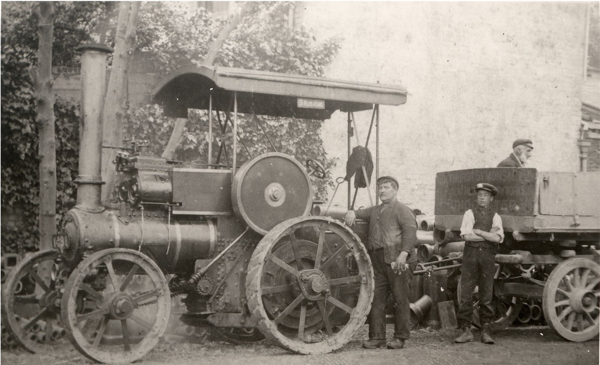 Transport - Two men and a child with a #Tasker B1 traction engine for W ...