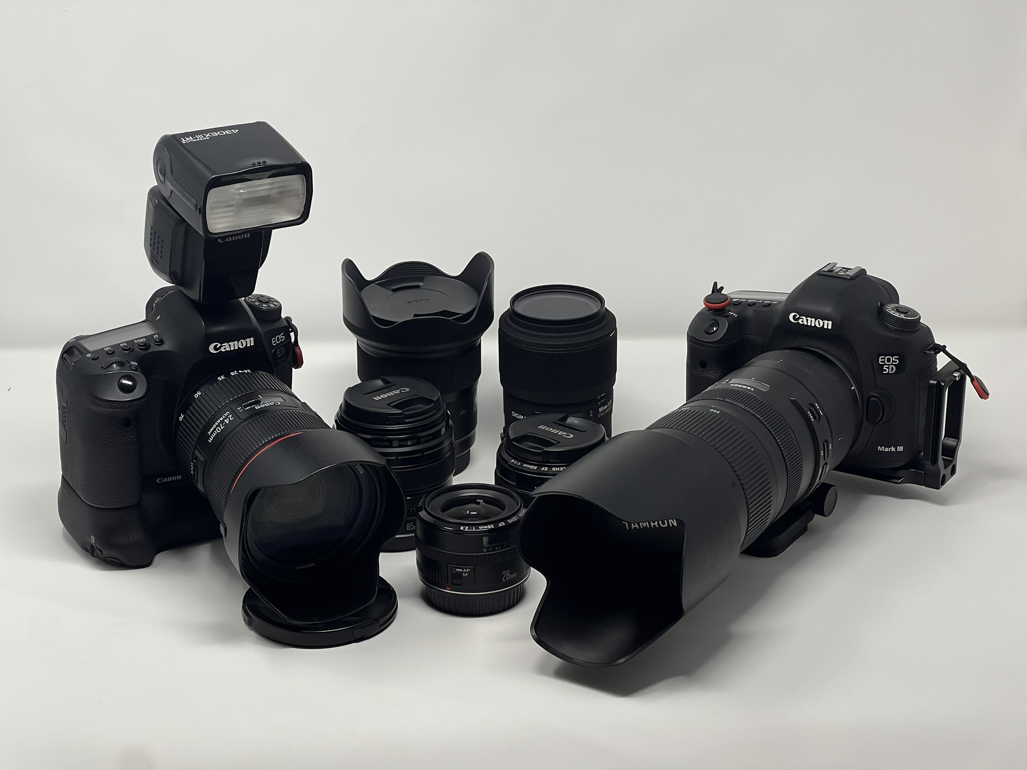 Should I keep or sell my prime lenses after switching to zooms for 