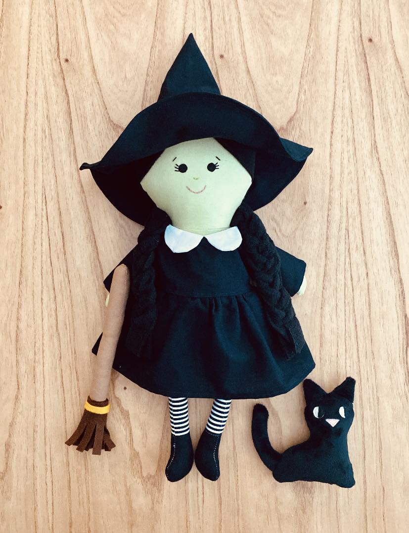 Handcrafted witch doll is made of felt and fabric. The doll has a