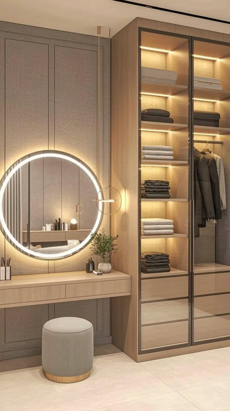 Creating an illuminated dressing room can transform your daily routine into a luxurious experience. The focus on soft, warm lighting accentuates the functionality and style of the space. An elegant round mirror