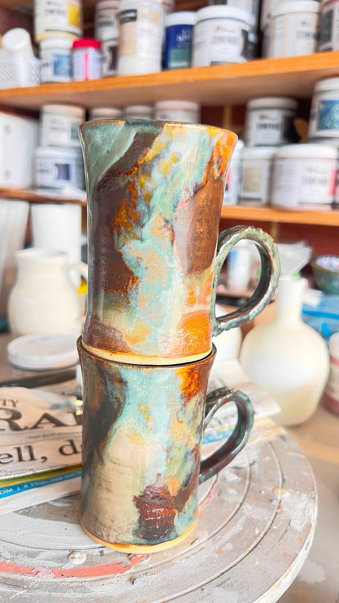 Ceramic mugs with Mayco's black walnut, stoned denim, birch, and