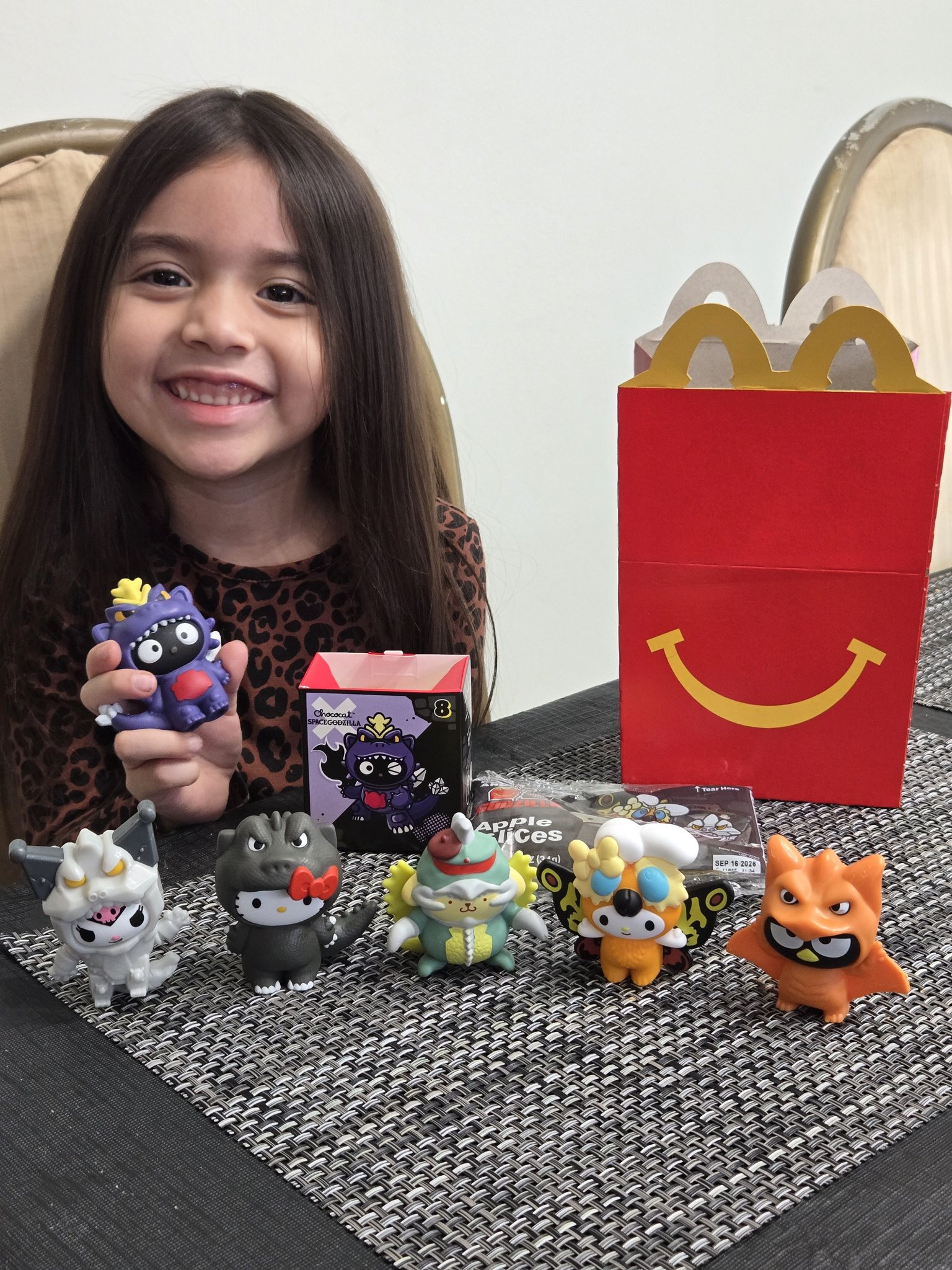 She's so excited because her Hello Kitty Godzilla collection from
