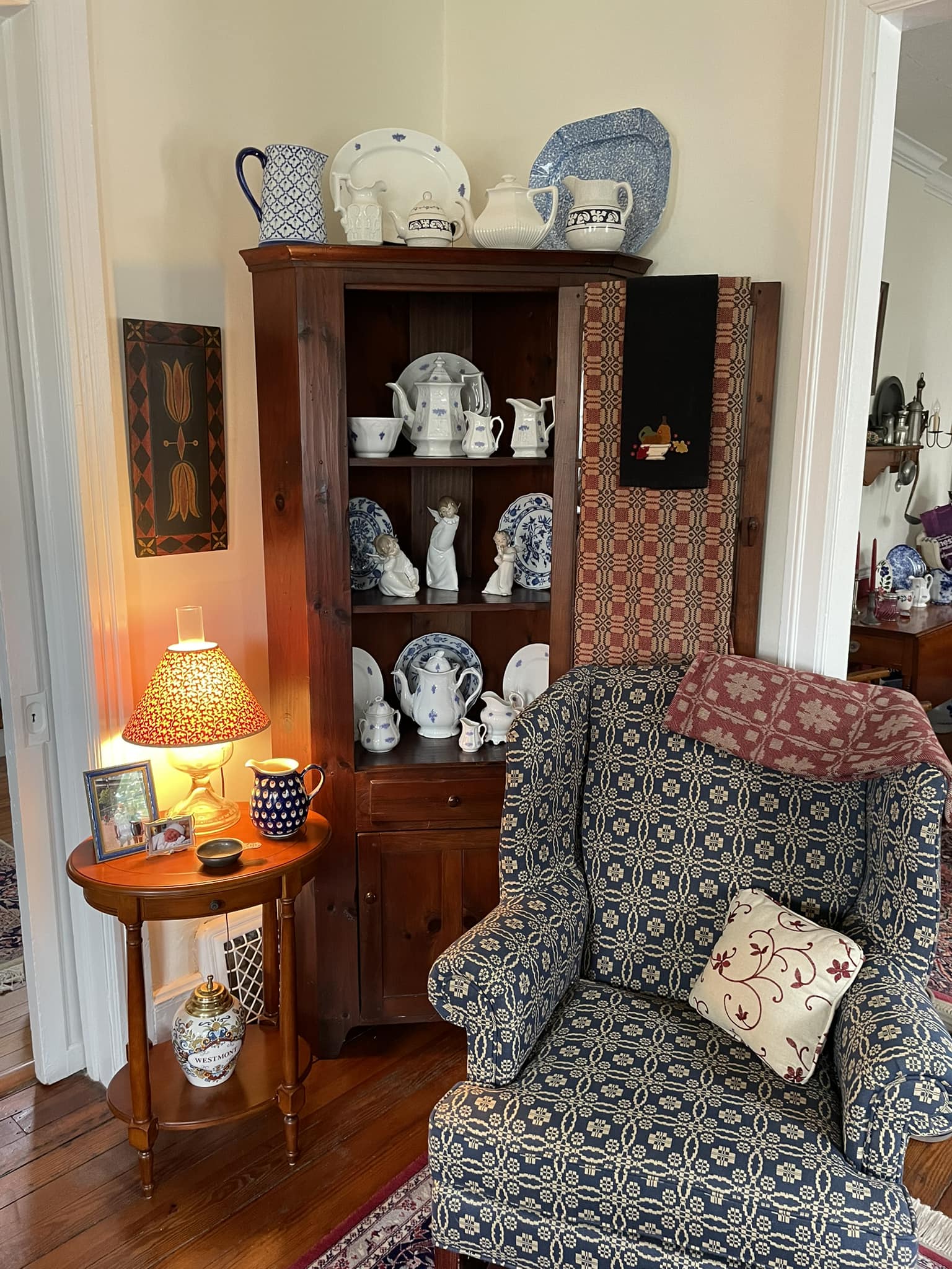 Early American corner cupboard with 18th and 19th century china