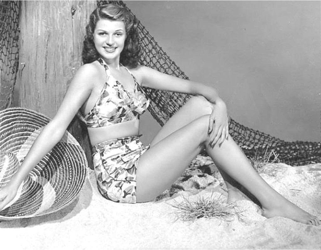 Rita Hayworth in 1948 with guitar and dog