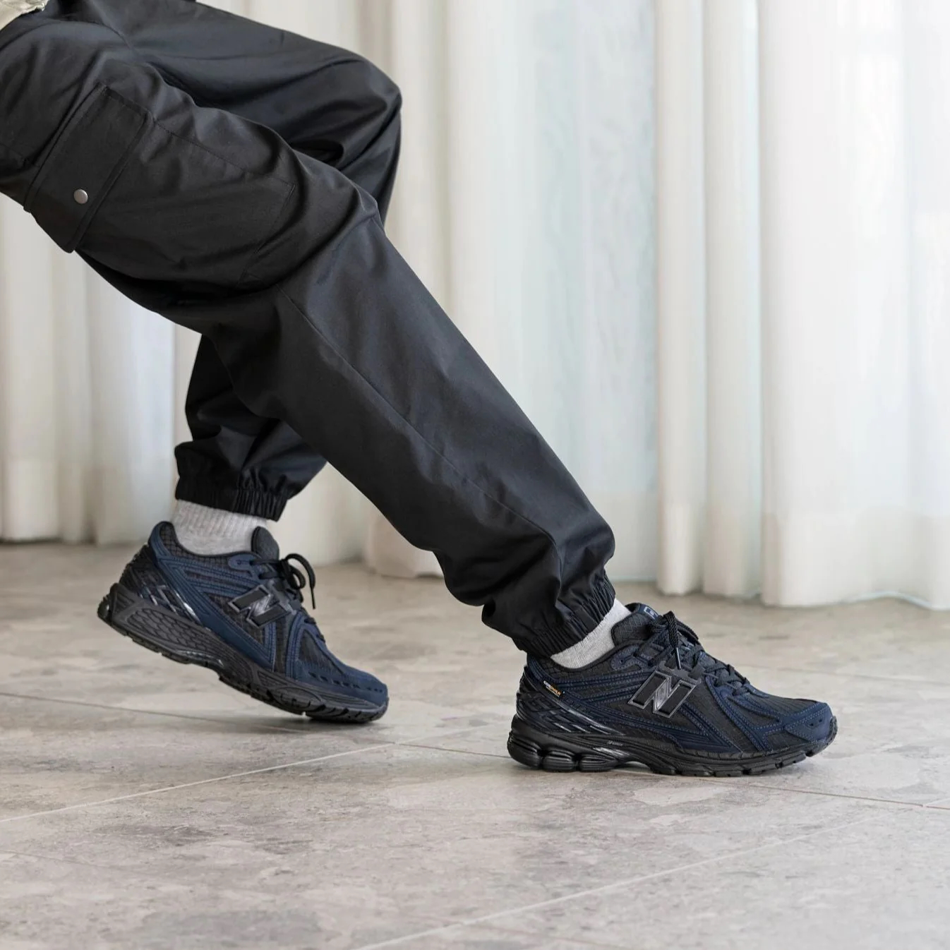 The New Balance 1906R arrives in Outerspace / Black. Crafted from 
