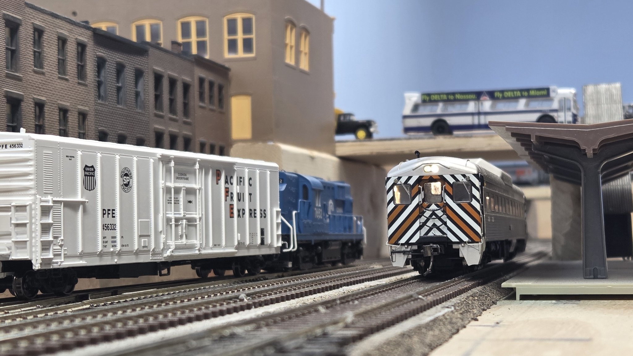 A mid-day RDC shuttle stops at Melrose Park, while the local pulls ...