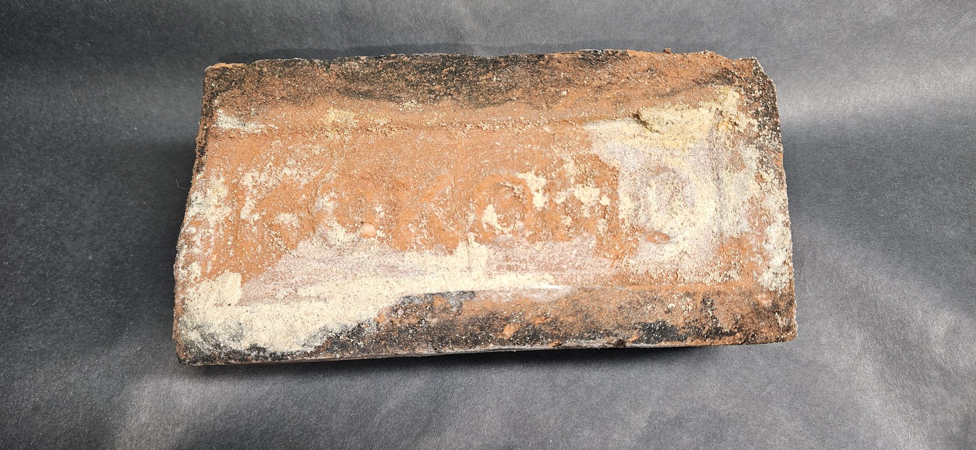 What is the age of a Kokomo stamped brick from Northern Indiana?