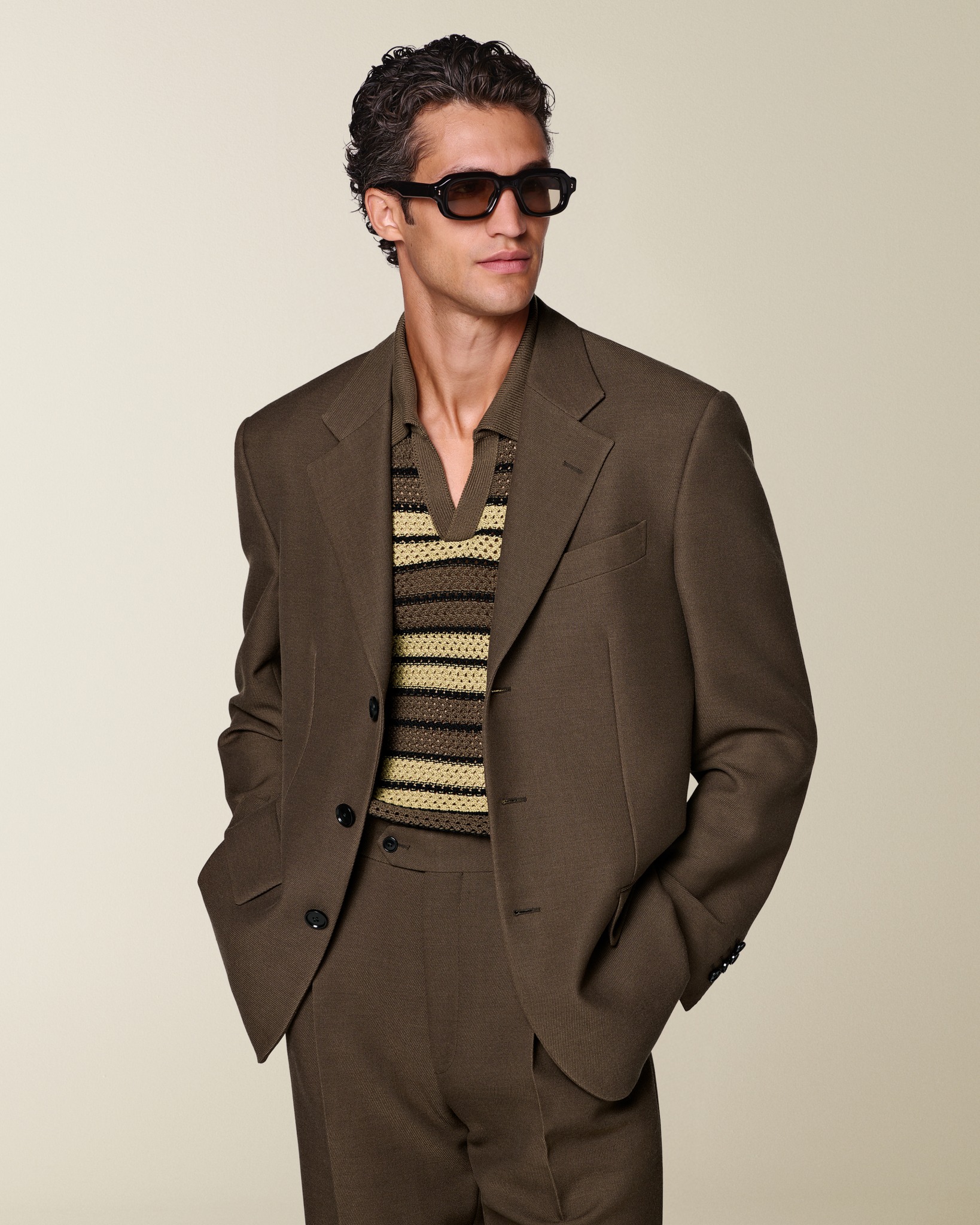 An easy shift into resort wear. This mid brown suit is styled with 