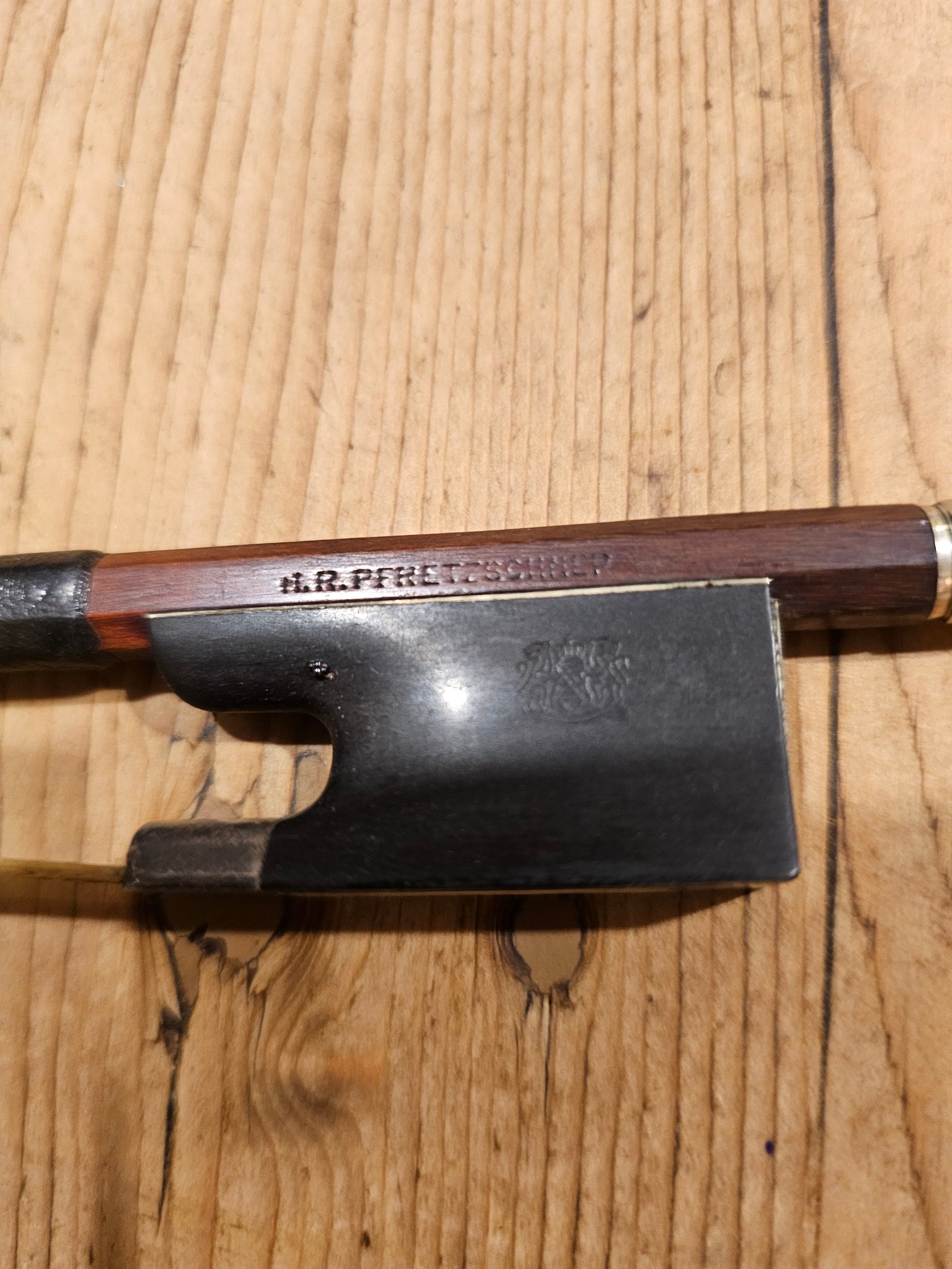 Hi I just acquired a violin with a bow stamped Hr PFRETZSCHNER 