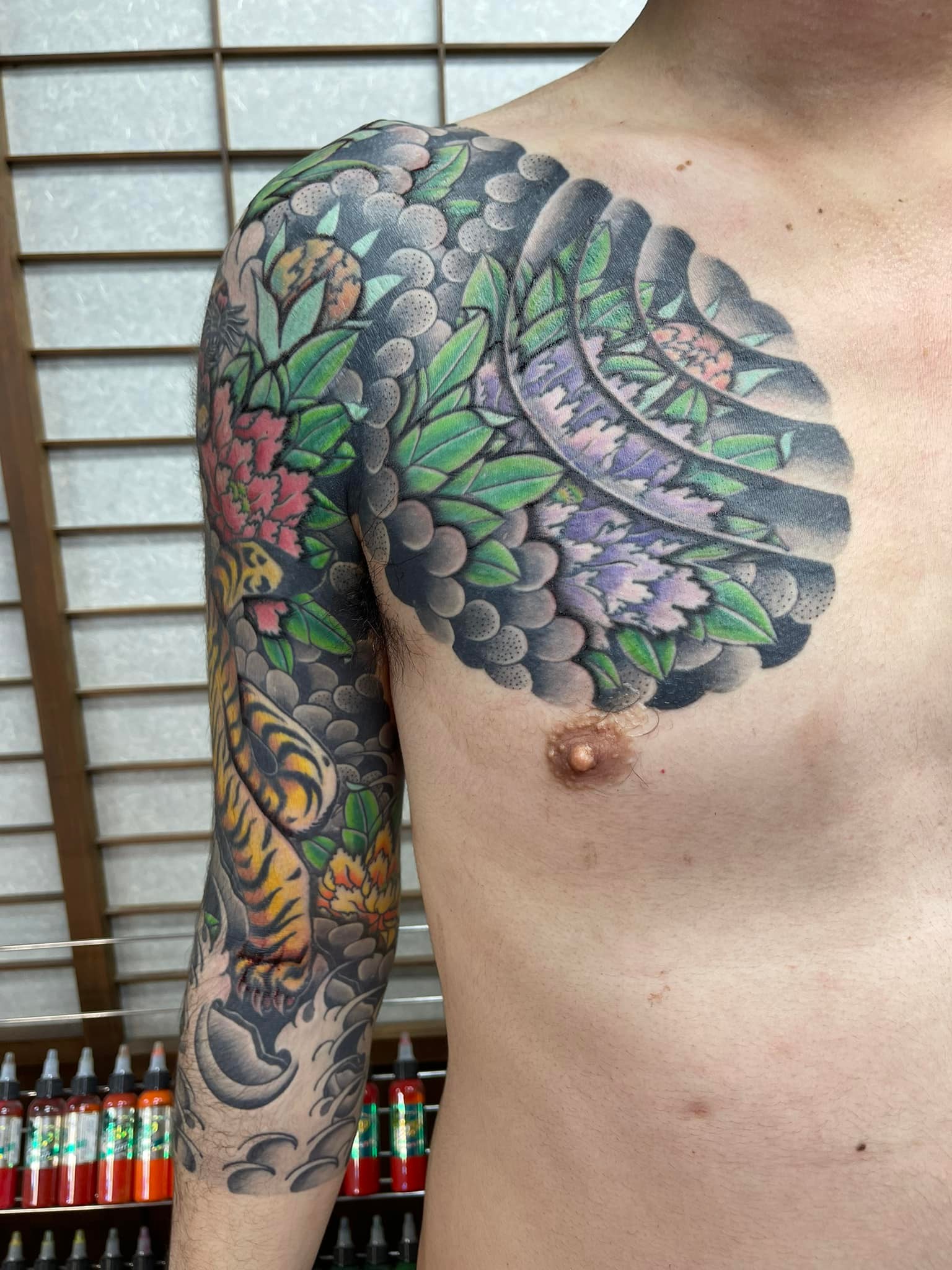 Tiger and peony wave tattoo sleeve by Choshu Horikazu