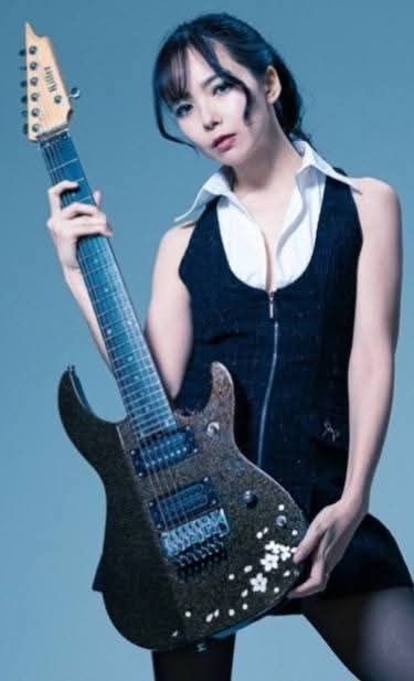Metal guitarist Saki and her signature model guitar