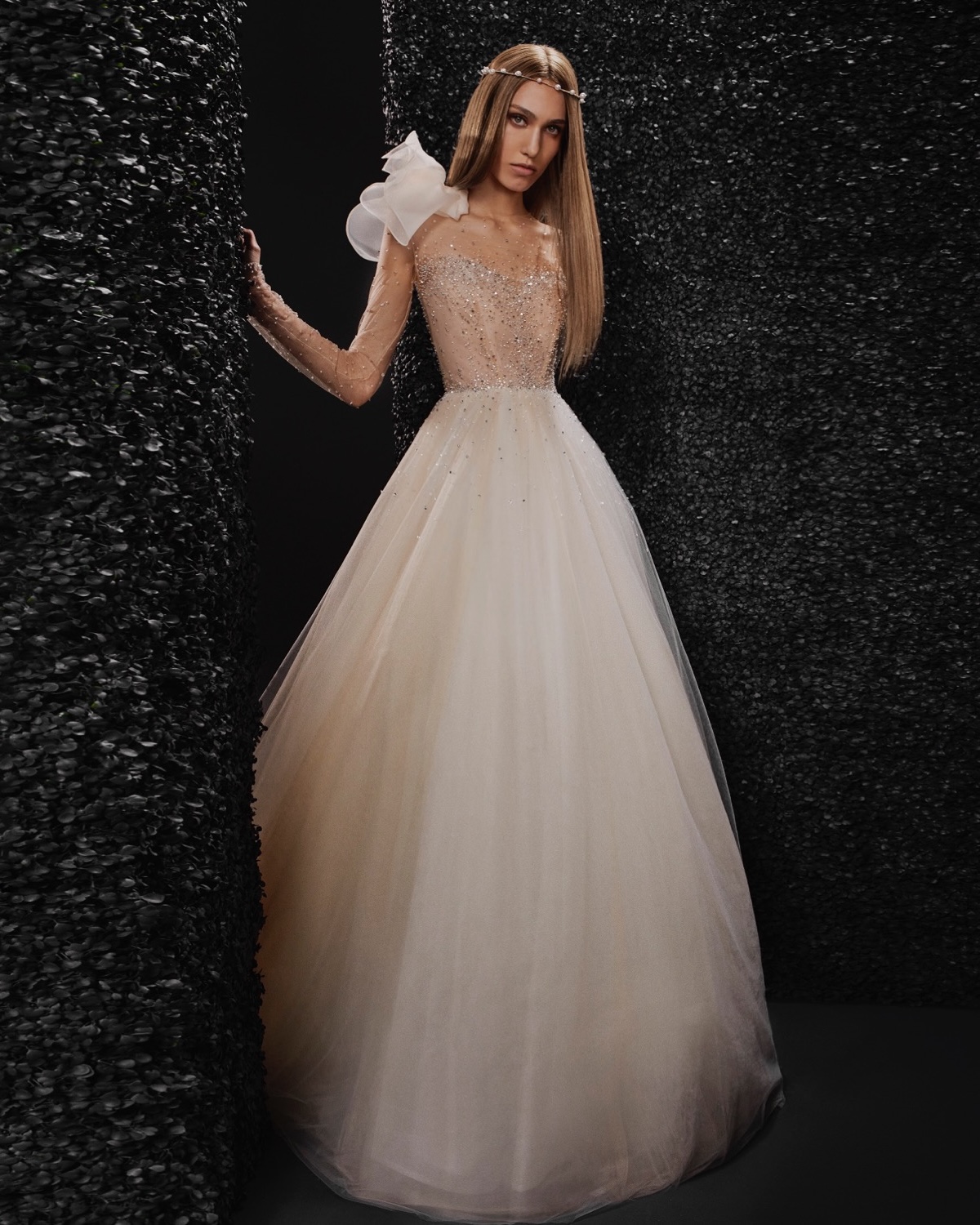 Embrace your inner radiance in this soft gold Vera Wang Bride MARION wedding dress. An elegant illusion neckline and long sleeves shimmer with the delicate sparkle of hundreds of hand-beaded details. The