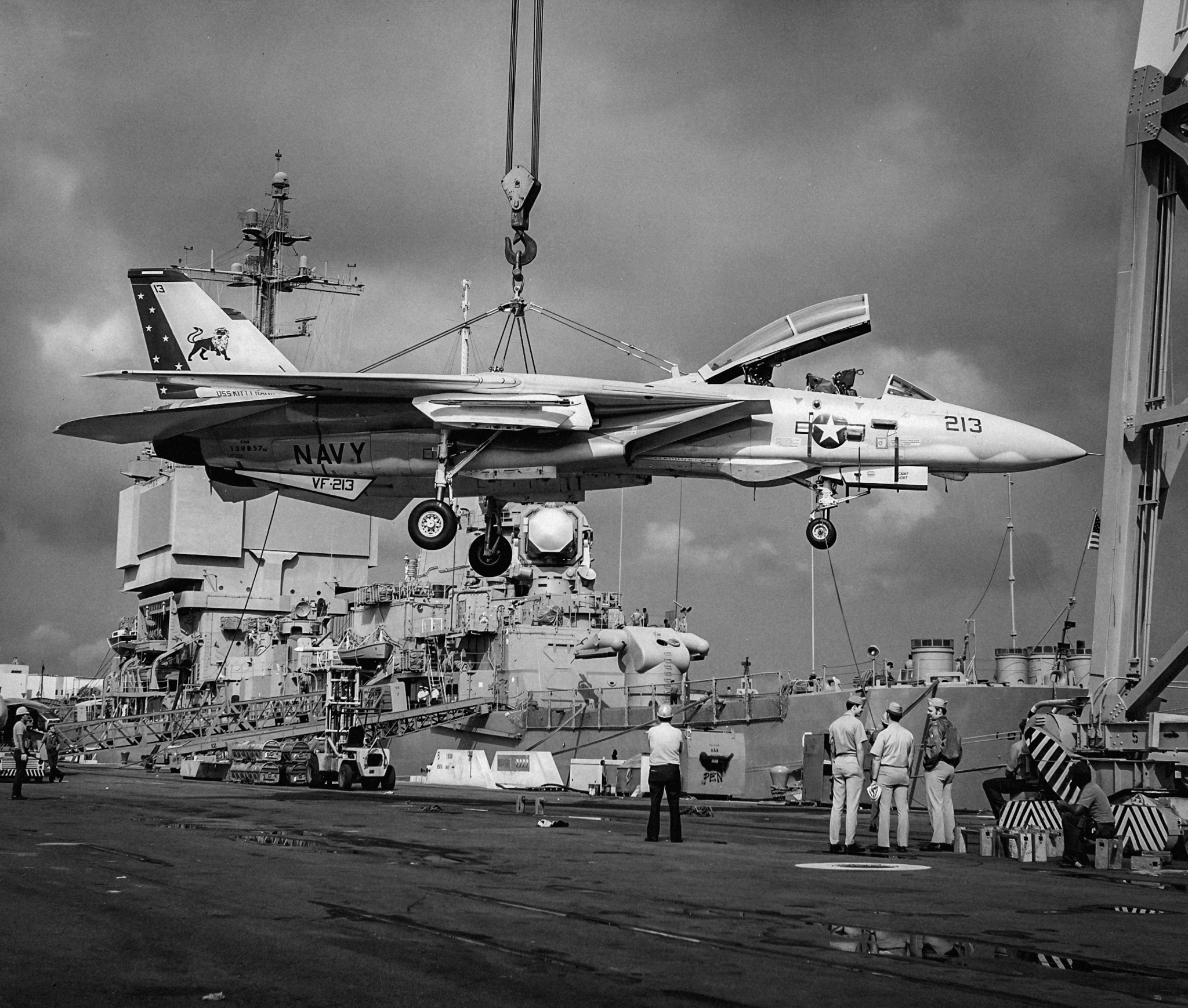 A VF-213 F-14A Tomcat is craned aboard USS Kitty Hawk at North