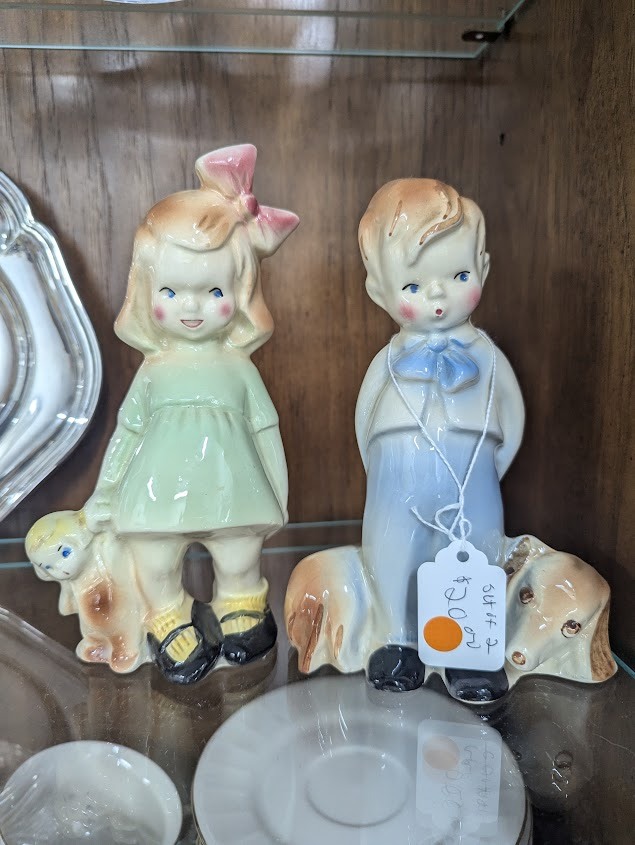 Boy and girl figurines. Two for $20 less 50%
