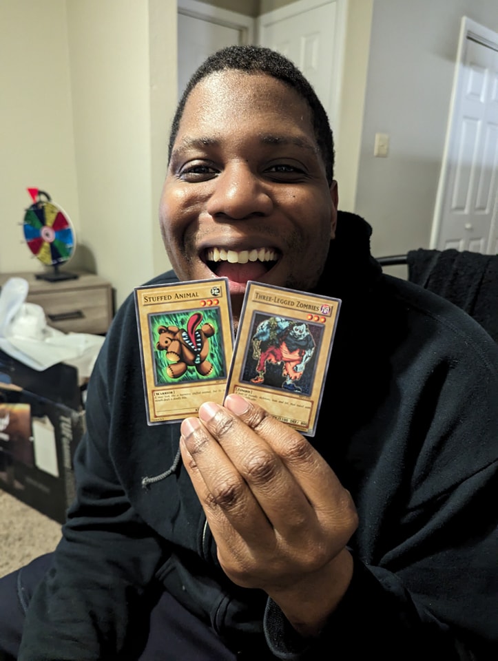 Alec opened an old Yu-Gi-Oh McDonald's pack by accident.
