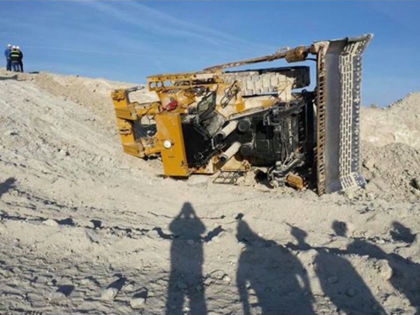 Mining - That's pretty tame ground for a dozer! wonder what happened ...