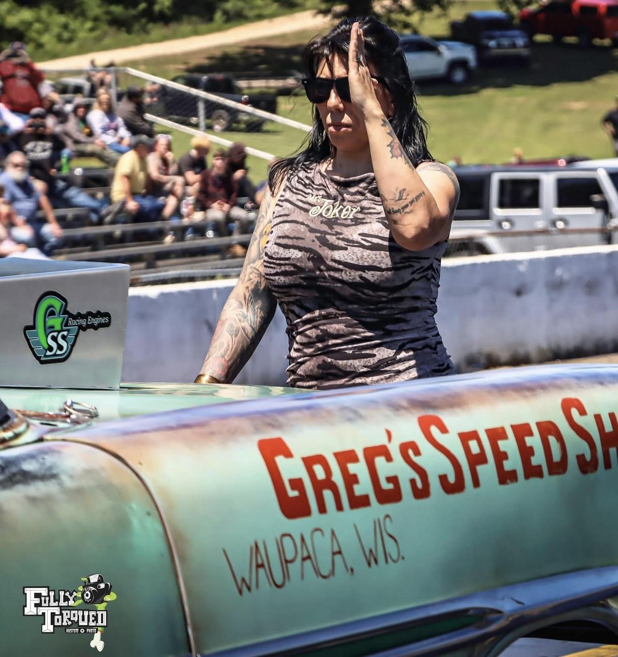 Locked in. While the crowd watches, Mrs. Joker is already focused