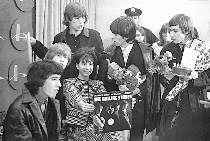The Rolling Stones take out some time for several greeting fans