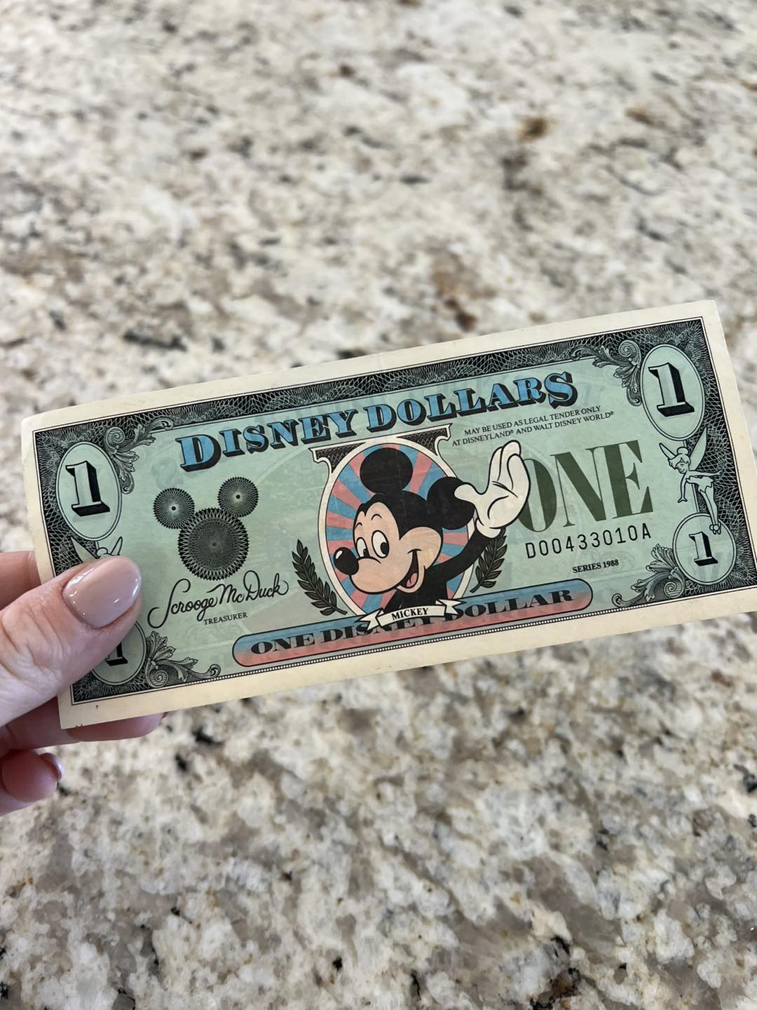 1987 – “Disney Dollars” roll off Mickey's printing press for the