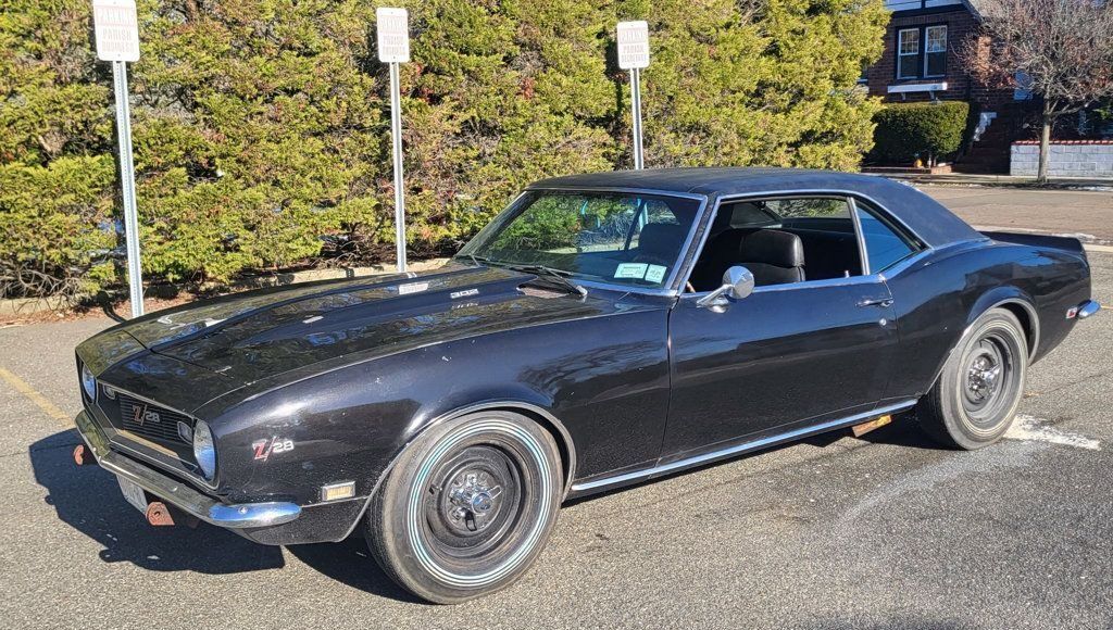 This is a 1968 Chevrolet Camaro Z28 finished in Black exterior