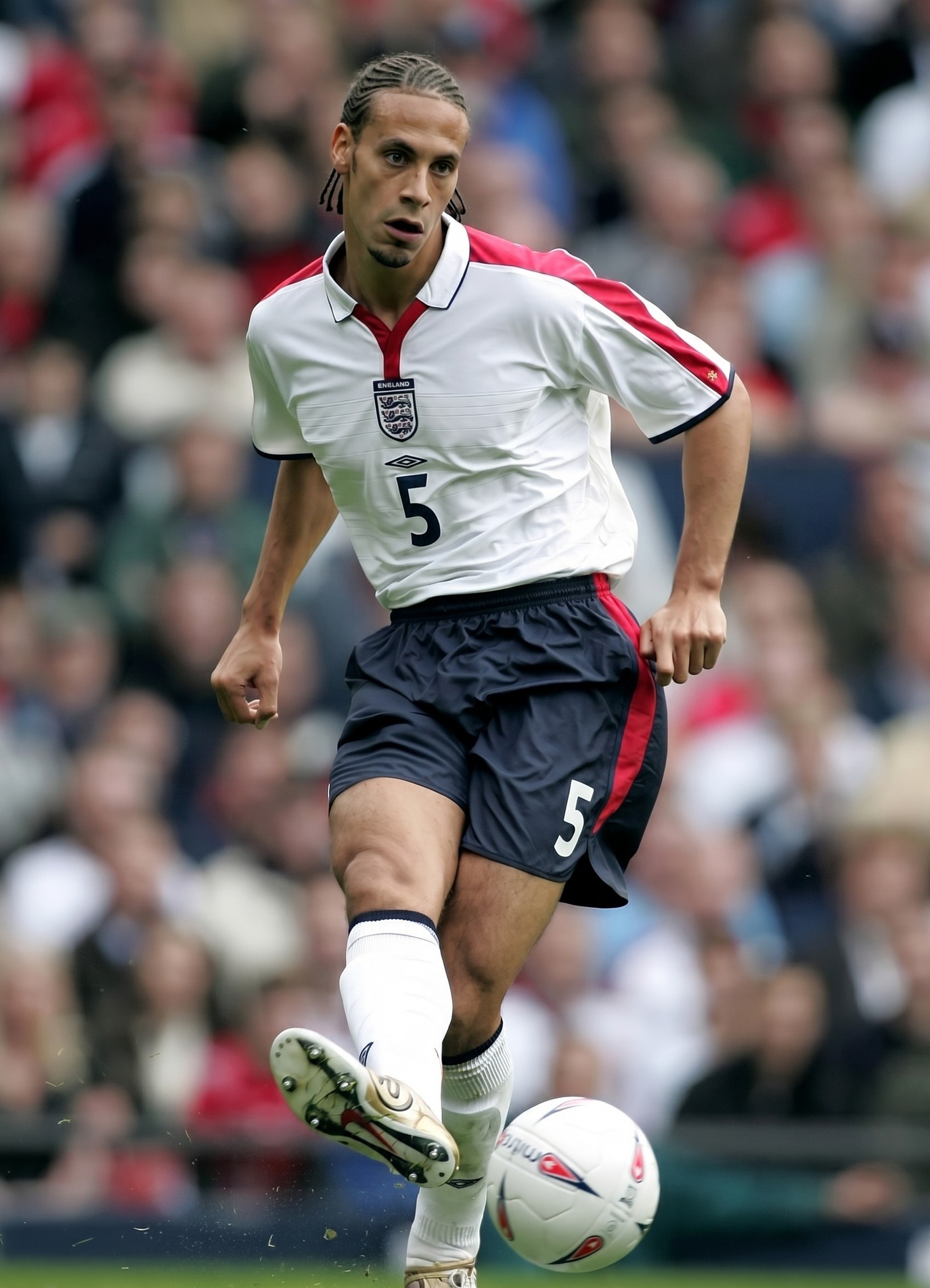 JUNE 15, 2002. Rio Ferdinand of England celebrates scoring the