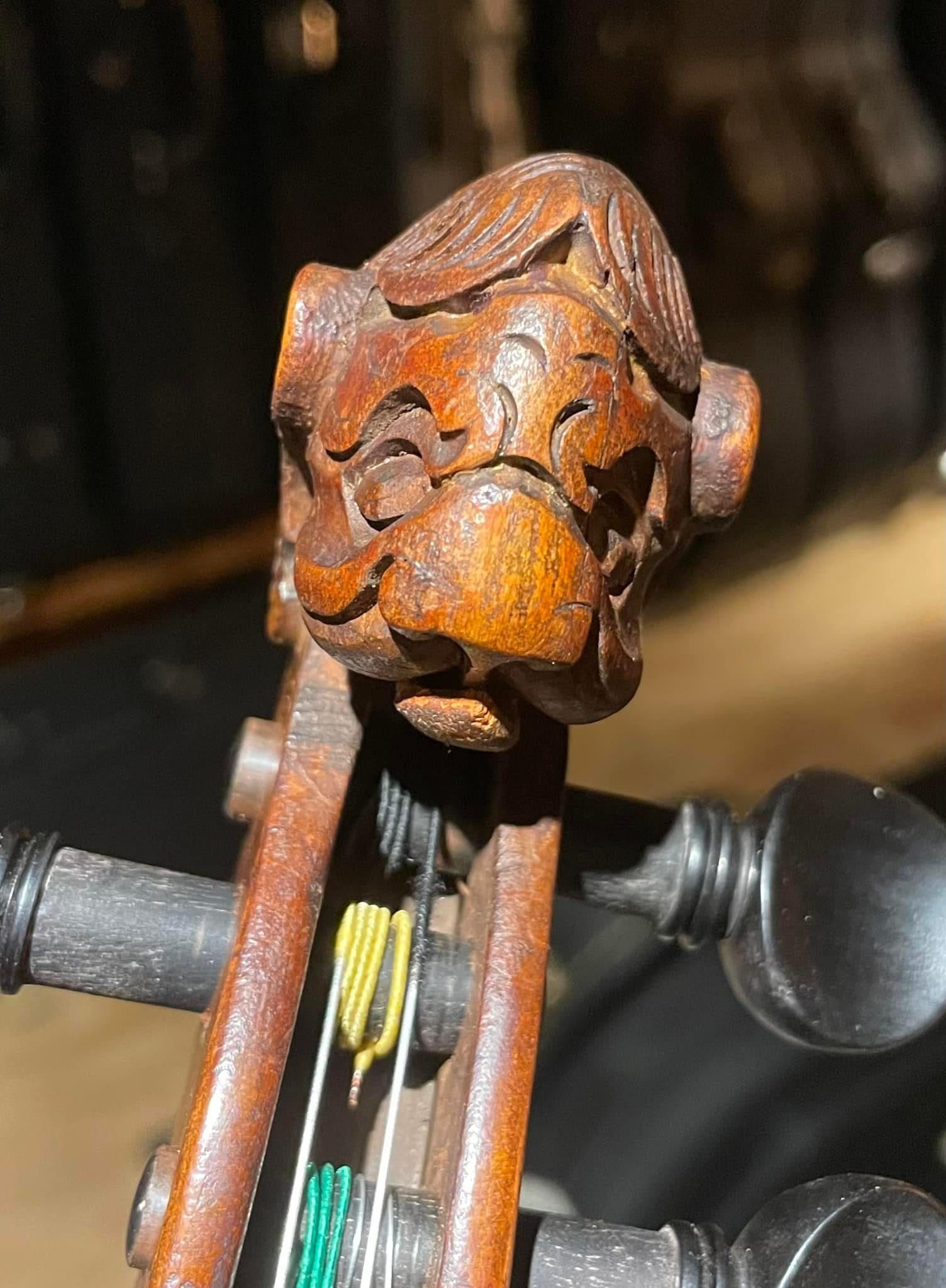 What is the origin and value of this unique violin with a lion's