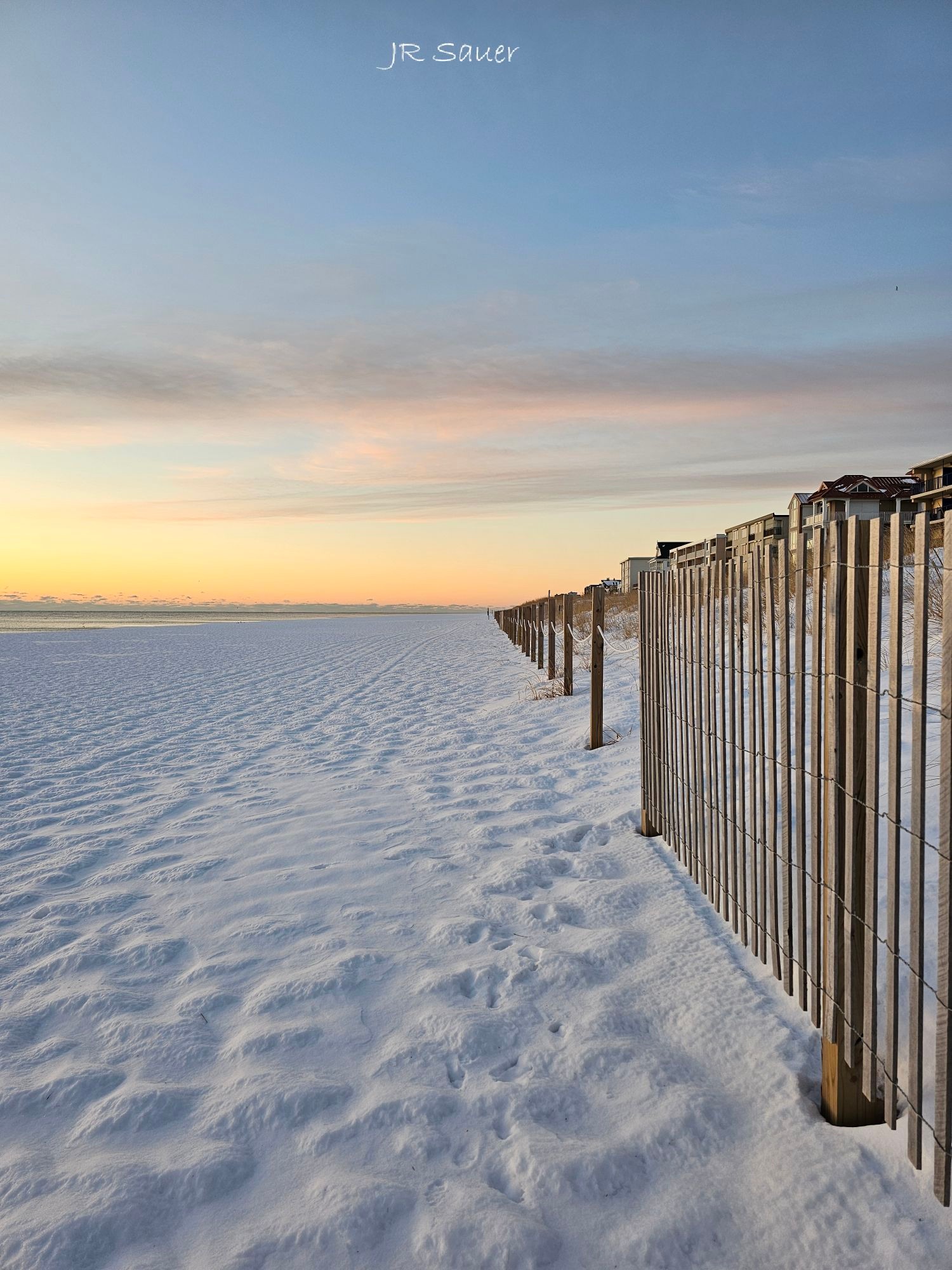 Peaceful snow covered beach in Ocean City, Maryland